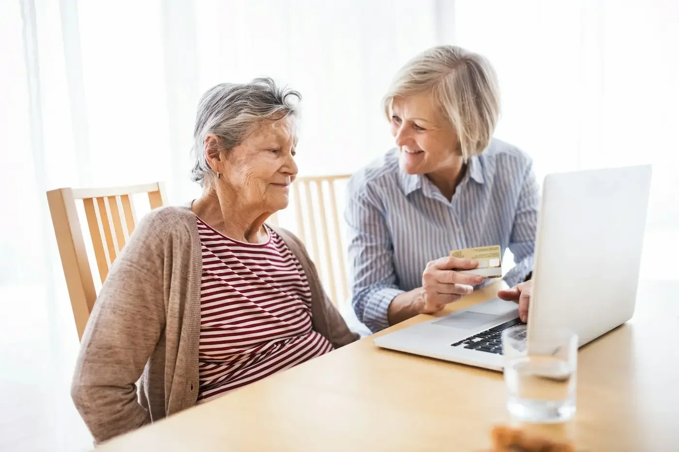 Caregiver assisting senior at home with non-medical support