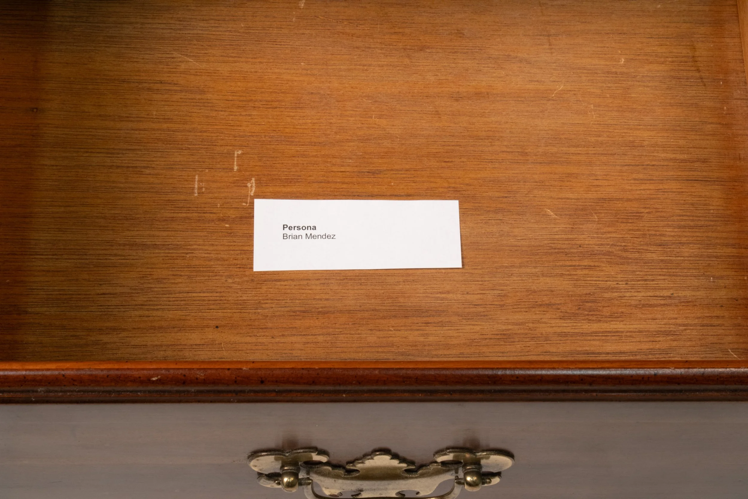 Intercambio de Fotografias entre Madre e Hijo, desde principios de Año, sobre
una Distancia de 1691.42 Kilometros. | 2025 | Interactive Sculpture | Inkjet Prints
and Found Furniture