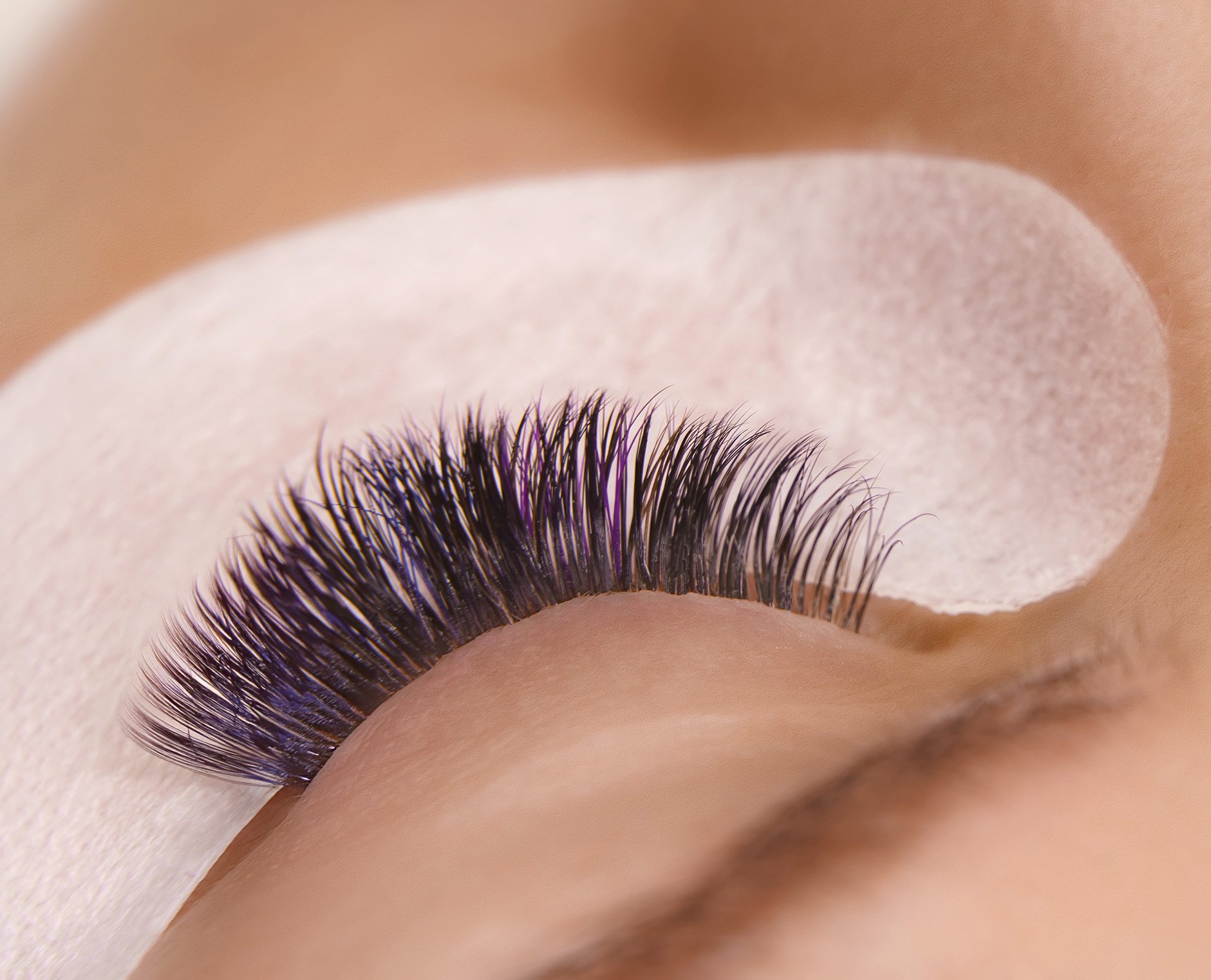 Close-up result of volume eyelash extensions by Pink Élan Lash in NYC, thick curled lashes with professional lash application