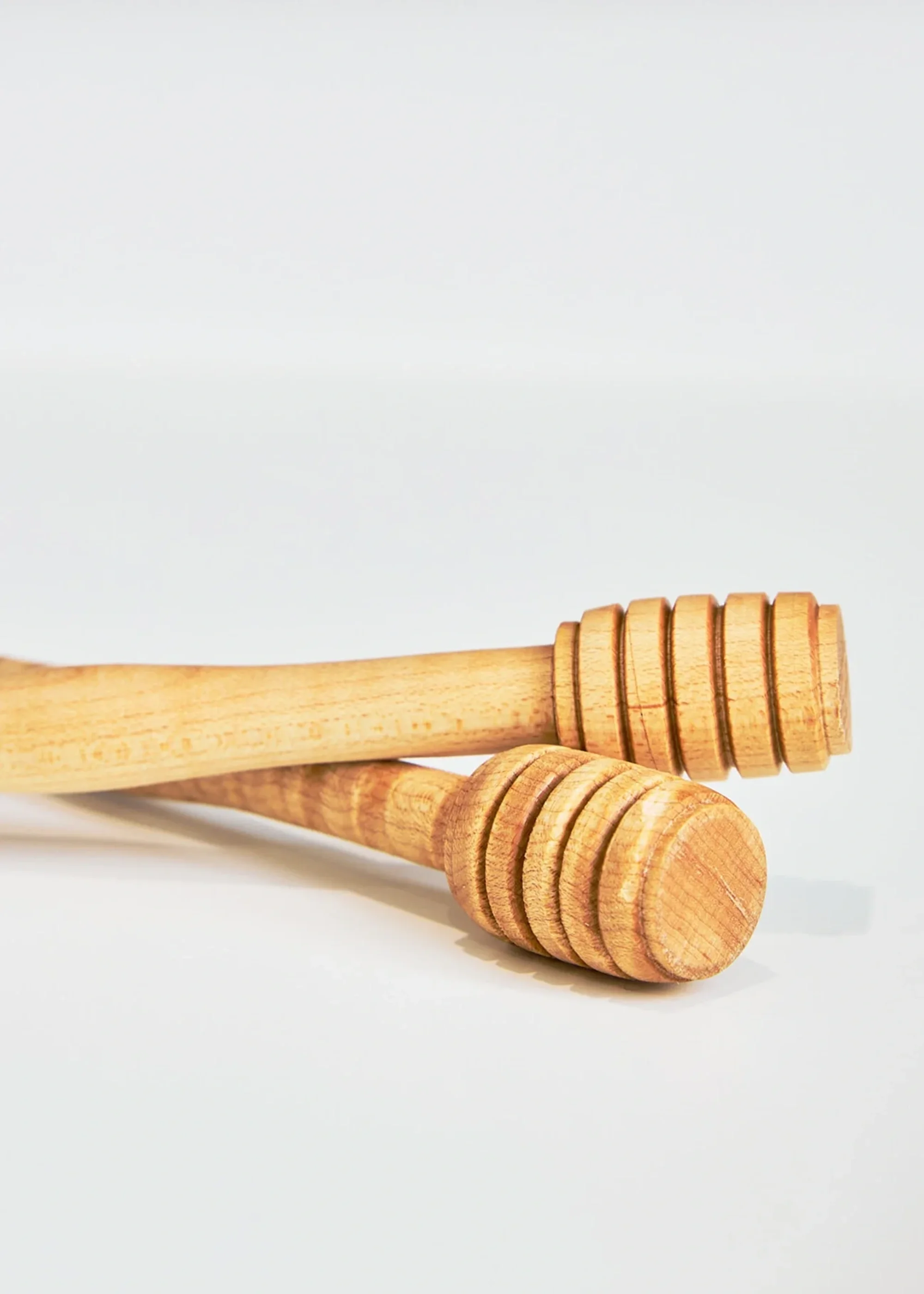 Close-up of two honey sticks