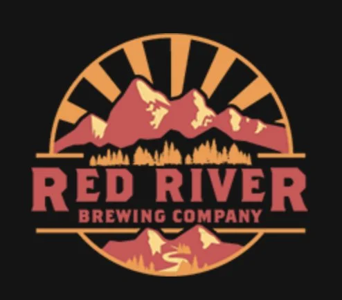 Logo of Red River Brewing Company featuring mountains, a river, and trees in a circular design.