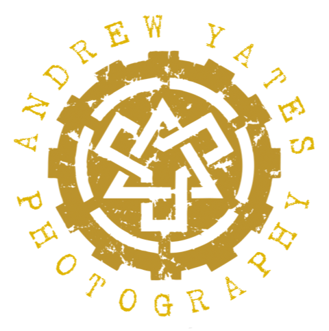 Circular logo with a maze design in the center and the text "AnyDrew Yates Photography" around the perimeter in yellow on a black background.