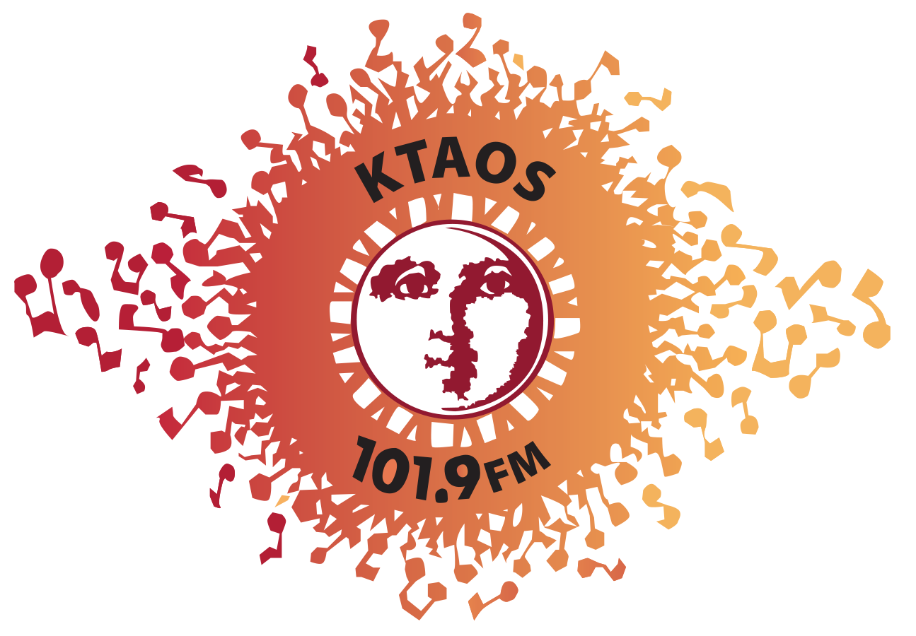 Logo for KTAS 101.9 FM radio station with a central face illustration surrounded by orange and red abstract shapes.