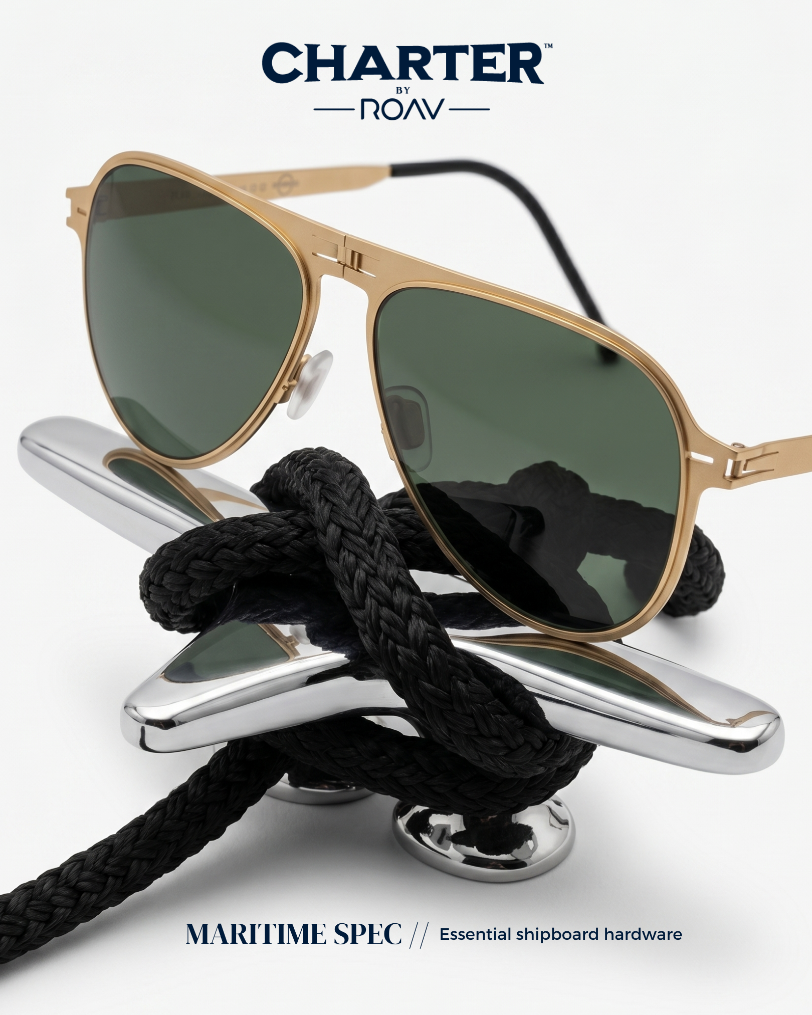A pair of gold sunglasses with dark lenses resting on a black rope, with a silver ship's cleat underneath, in front of a white background with blue text that reads "CHARTER BY ROAV" and "MARITIME SPEC // Essential shipboard hardware."