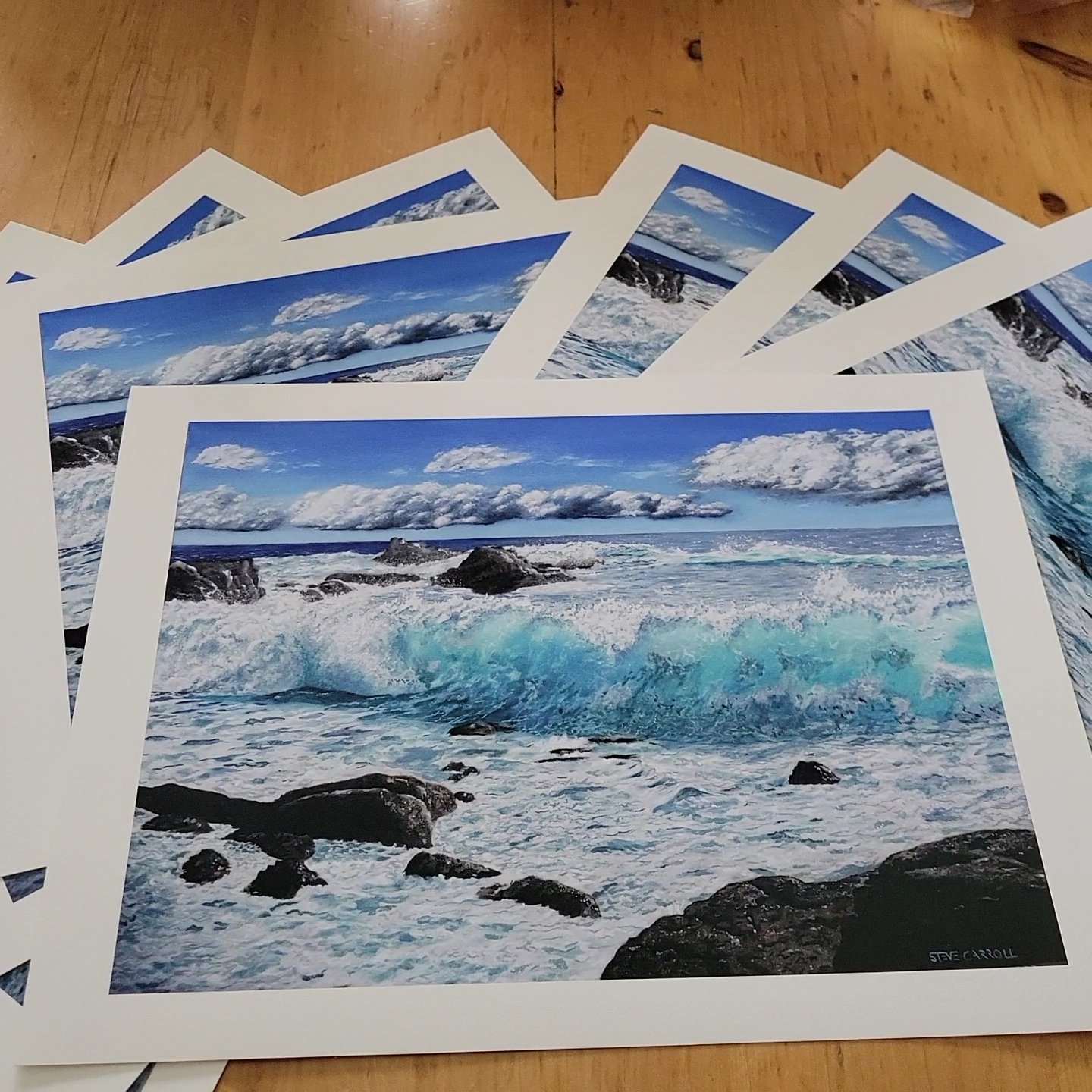 Giclee archival prints of a oil painting by Steve Carroll of a coastal scene with crashing waves, rocks, and a cloudy sky.