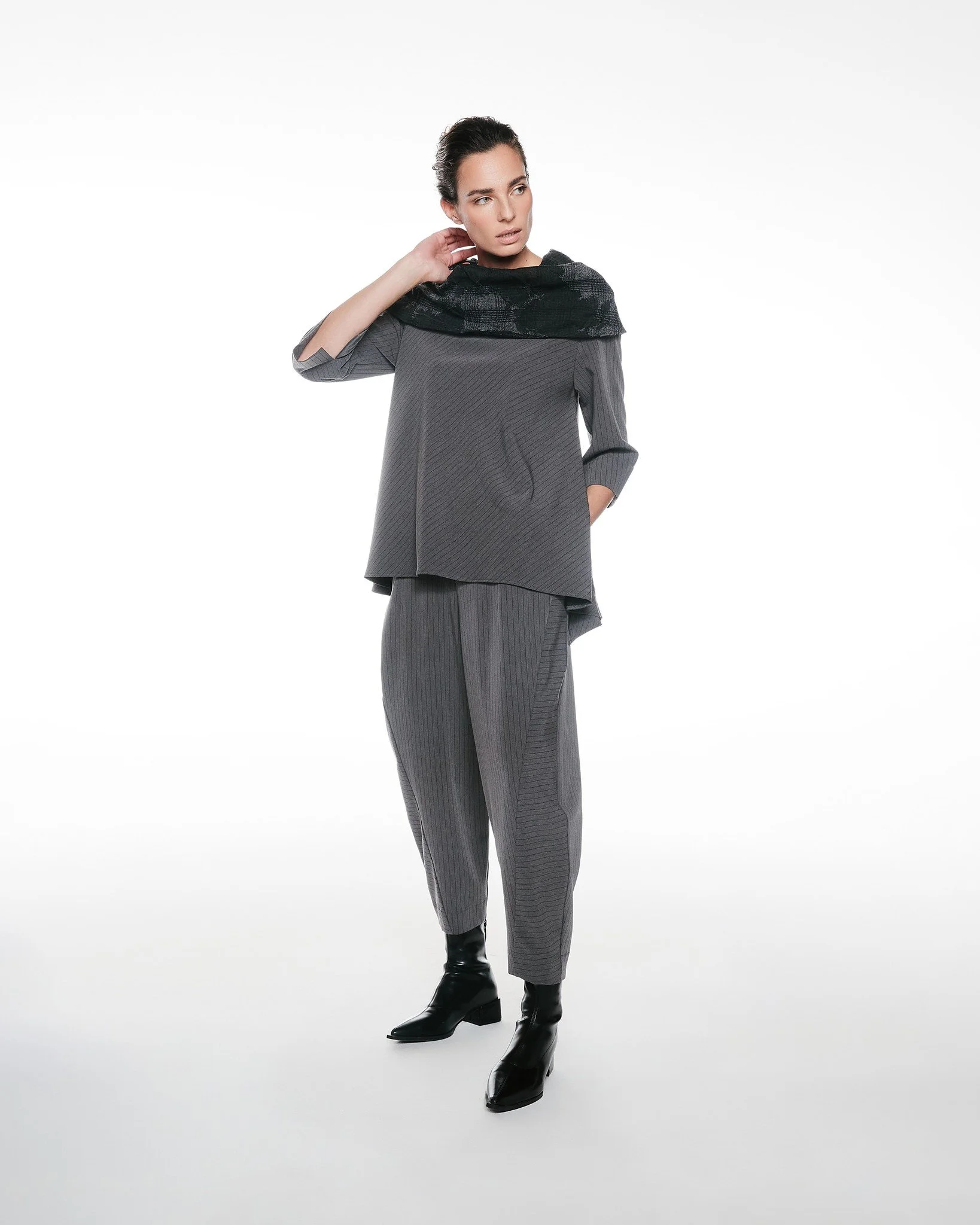 Featuring: Top Lavander

Top Lavander is the definition of effortless sophistication. Designed with a fluid, sculptural drape and subtle texture, it falls beautifully on the body while offering a relaxed yet refined silhouette.

Modern, versatile, an