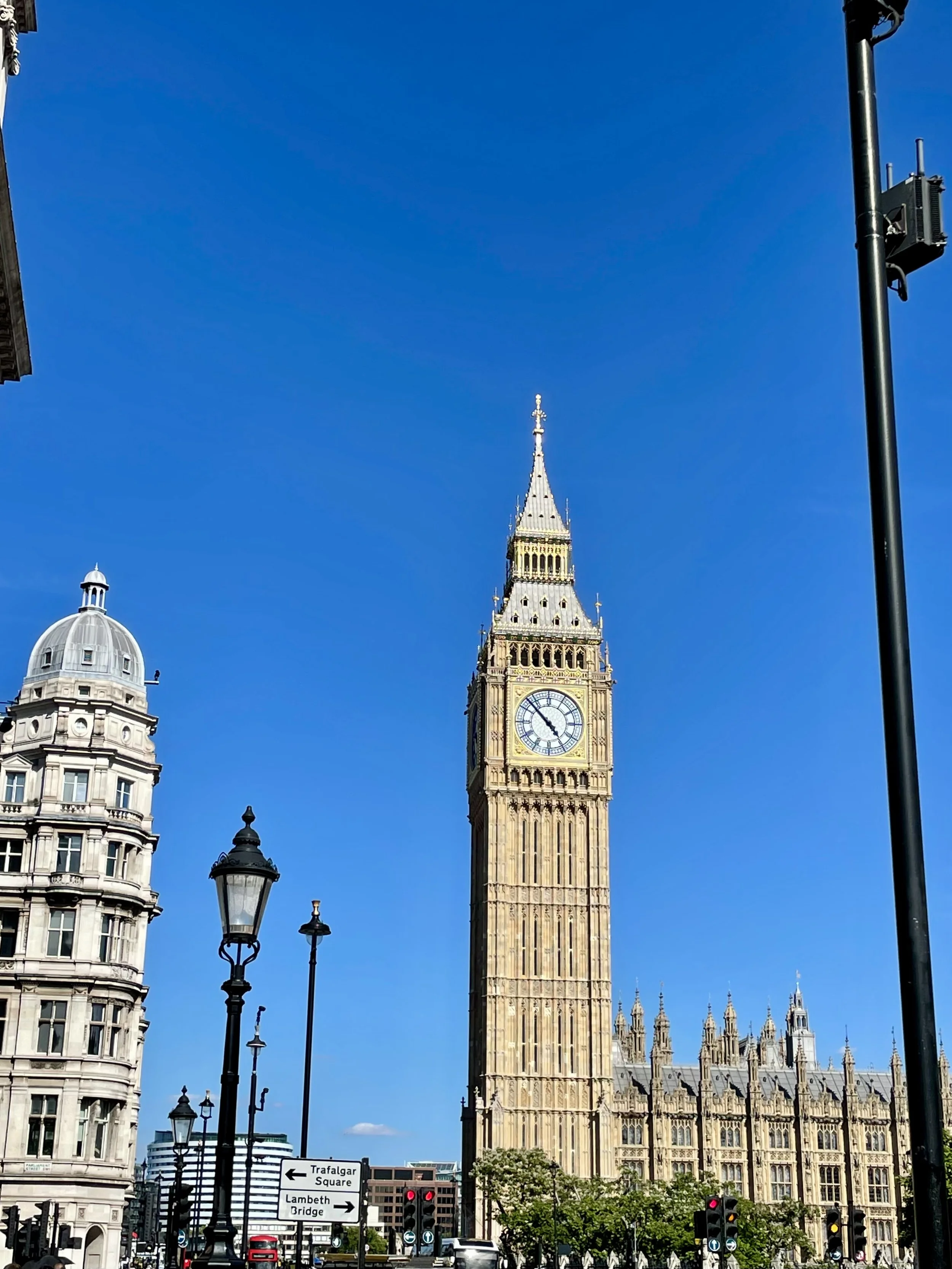 Photo shows Big Ben clocktower in London, steps from the Four Seasons Hotel at Park Lane, on a sunny day.