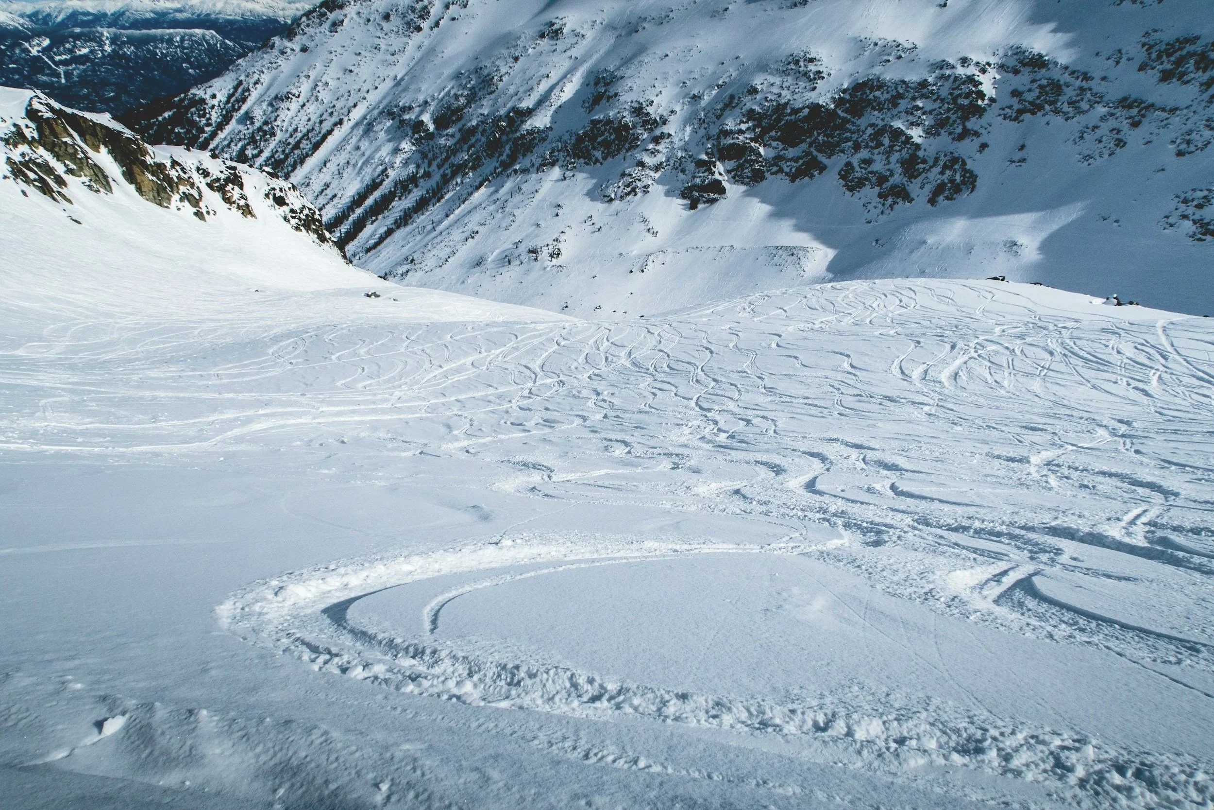 Photo shows ski tracks on Whistler Blackcomb Ski Resort. 