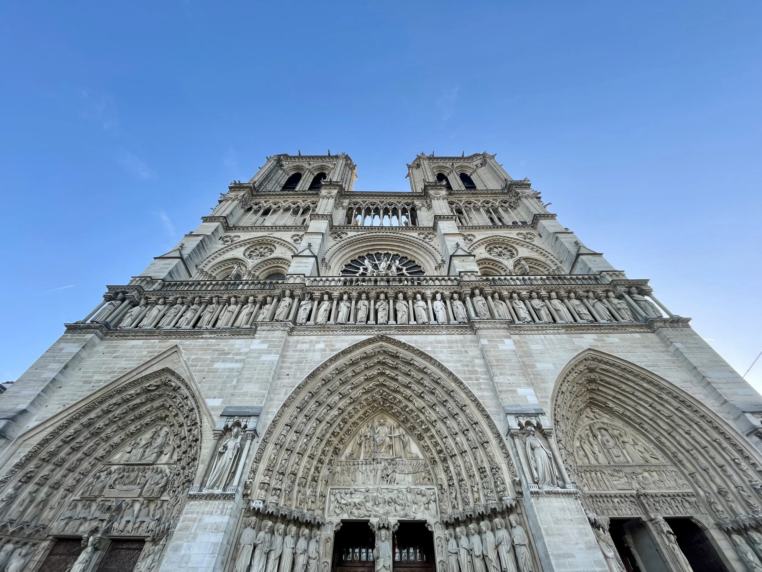 Photo shows the facade of the Notre Dame Cathedral in Paris since the restoration on a sunny day. 