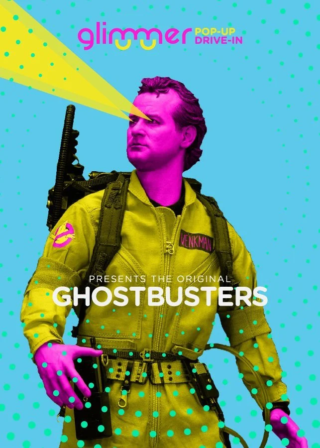 Poster for the original Ghostbusters featuring a man dressed as a ghostbuster with pink skin, yellow jumpsuit, purple gloves, and a backpack. The background is blue with green polka dots, and the text includes 'Glimmer Pop-Up Drive-In' and 'Ghostbust