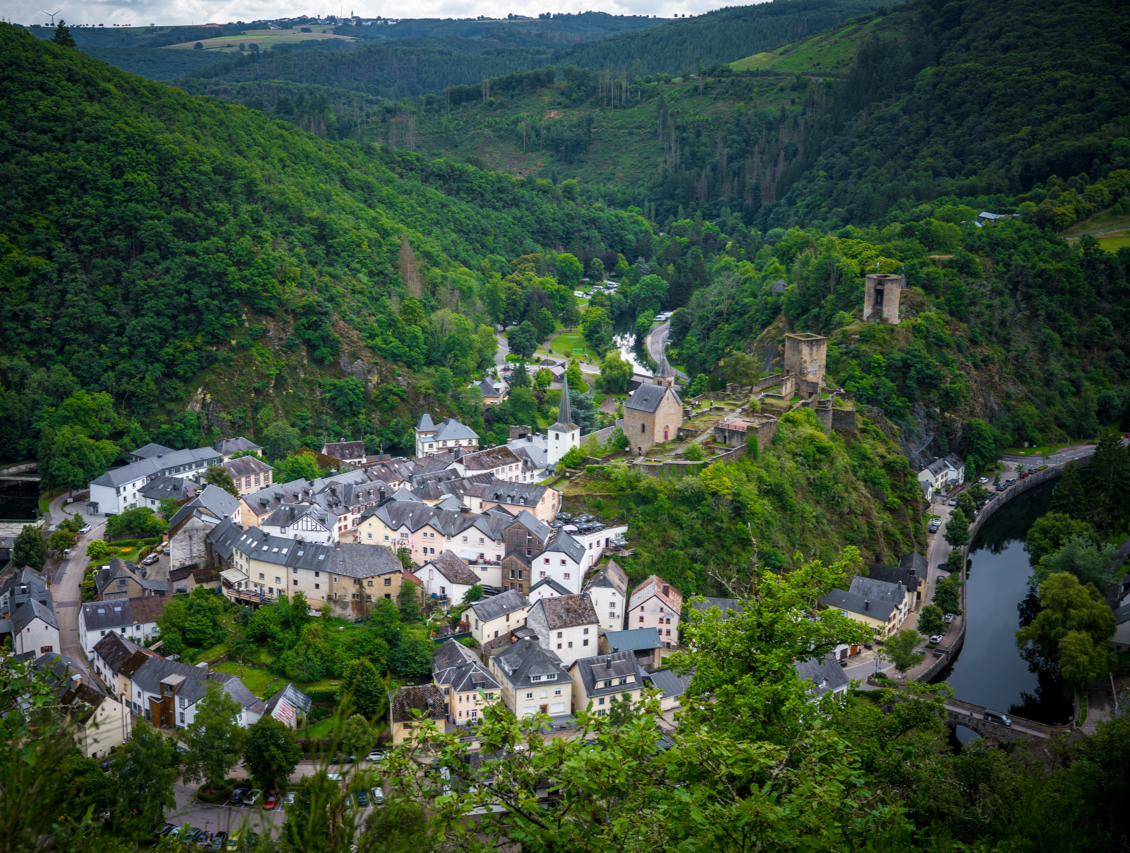 A view of Esch-sur-Sûre in Luxembourg, representing the goal of cultural integration and fluency for students taking the Sproochentest.