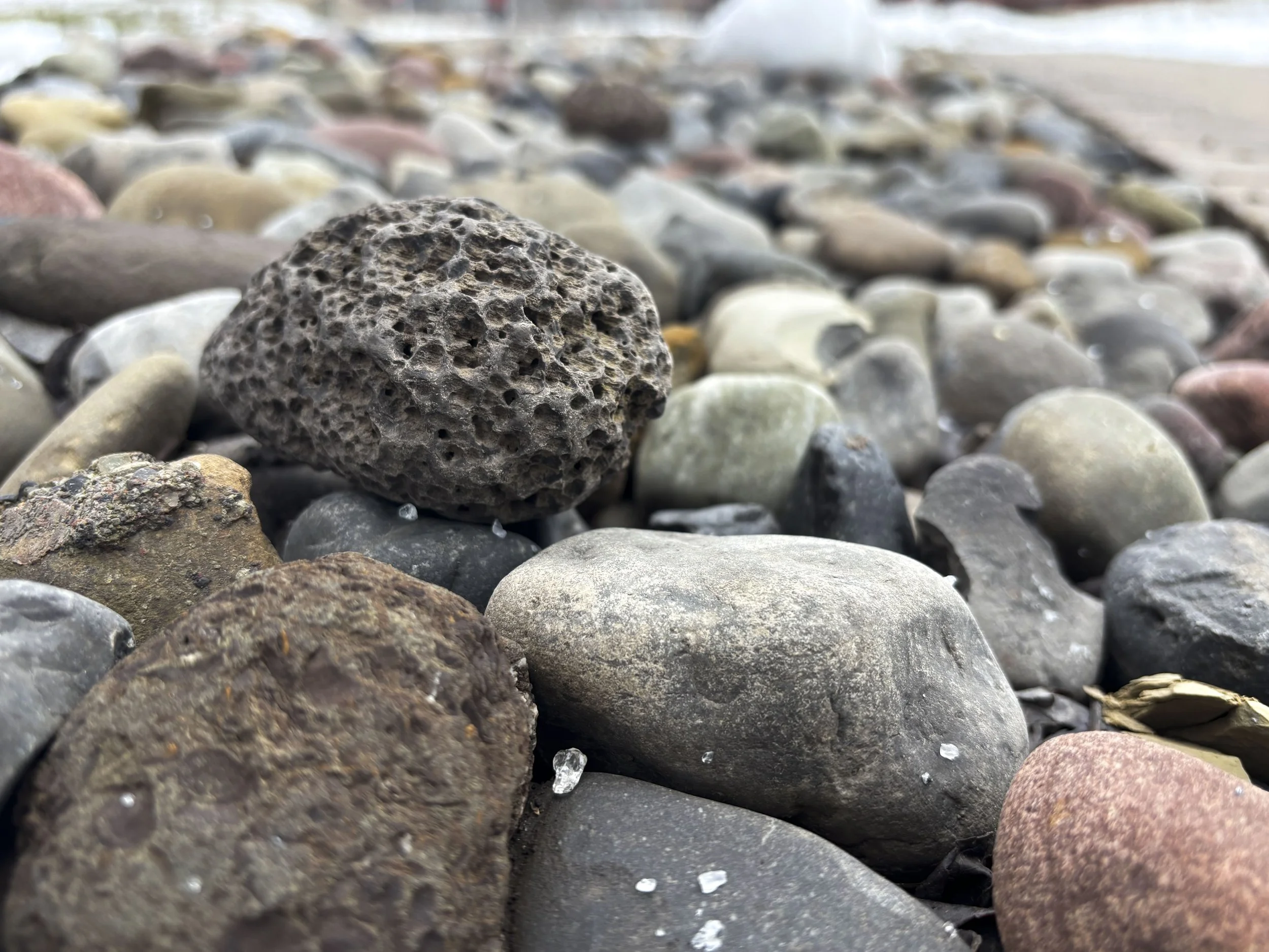 Close-up of various colorful rocks and pebbles at Syracuse