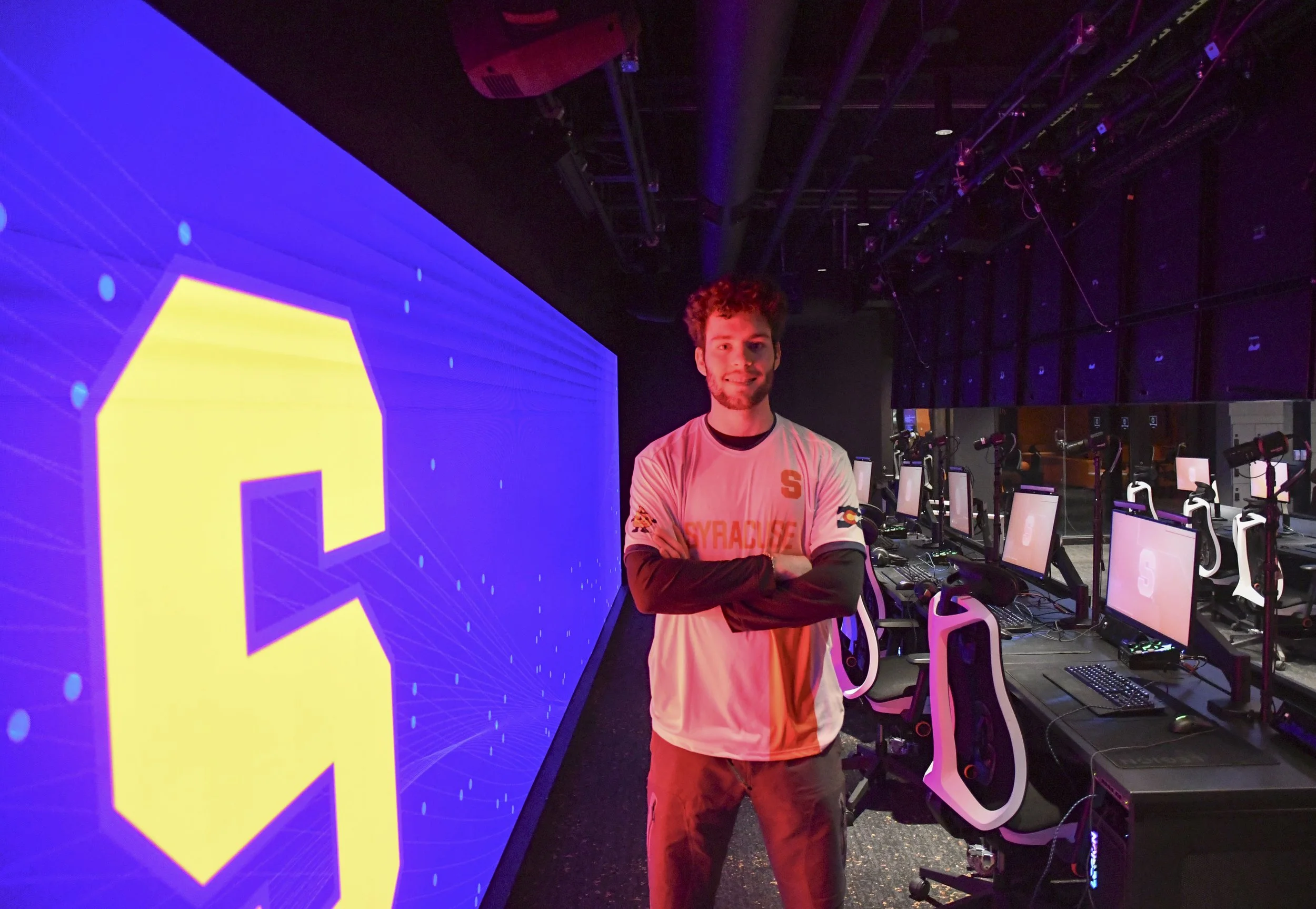 Anthony Solt poses for the camera in the gaming room.