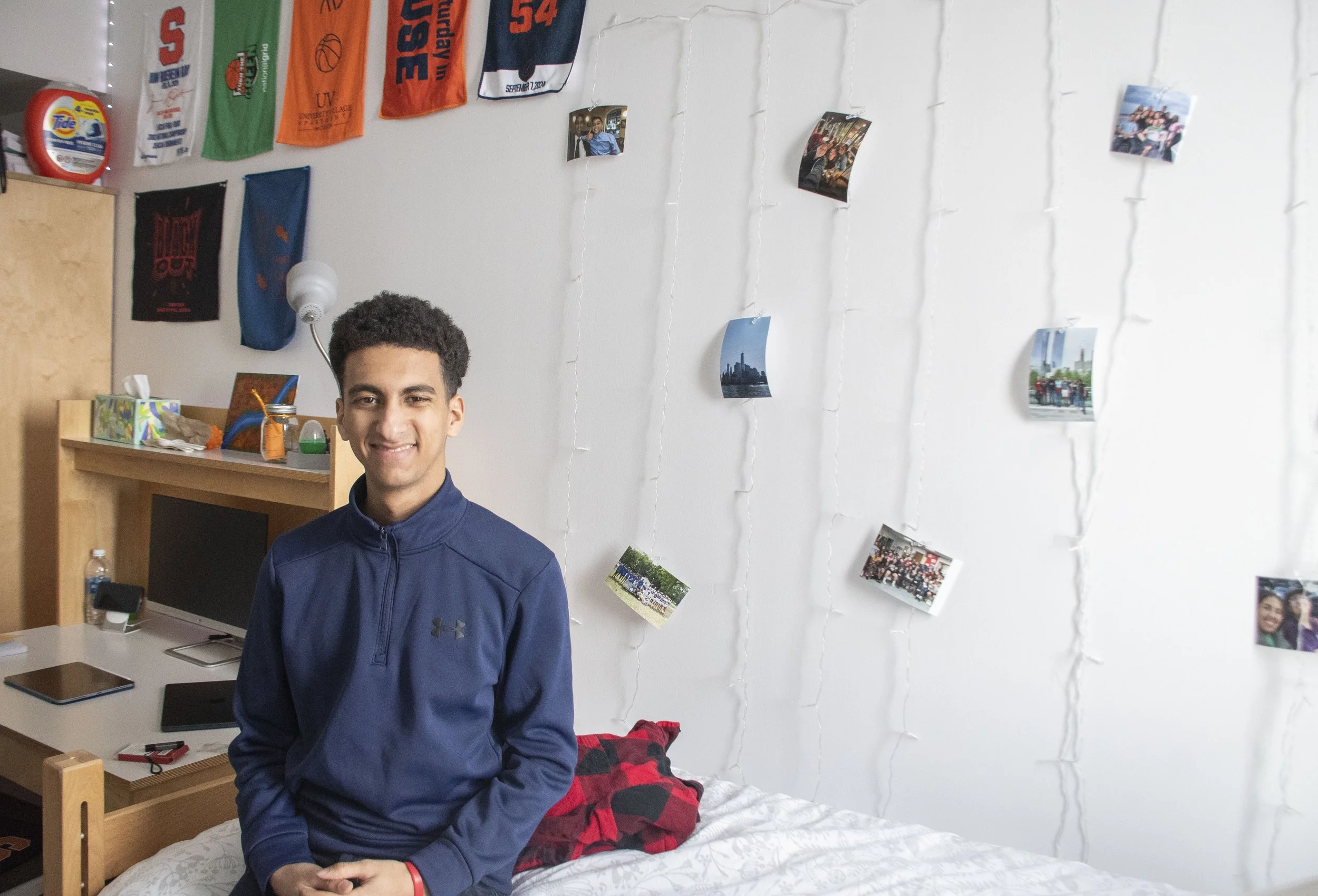 Noah's friend Elyas posing at his desk