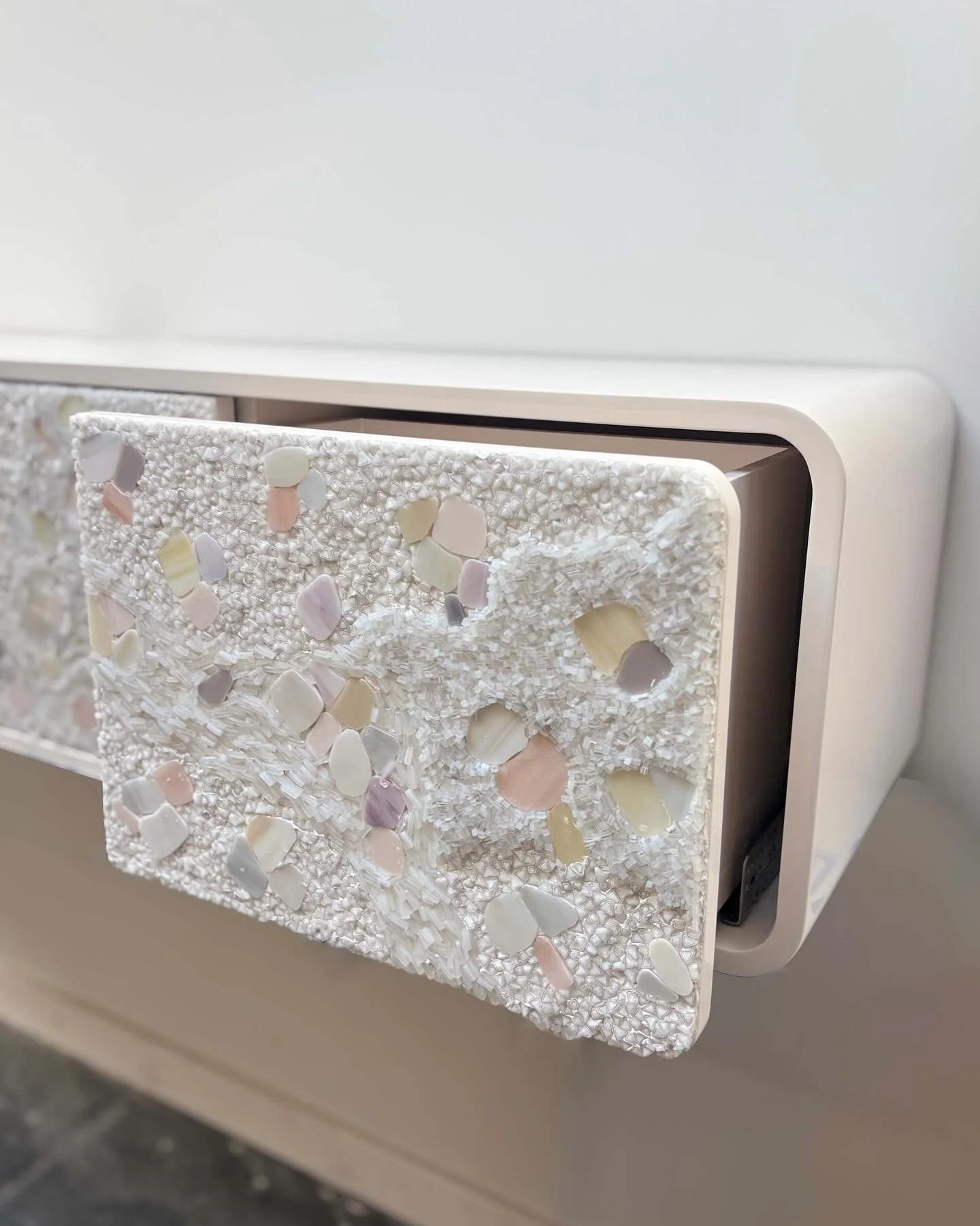 A new abstract constellation mosaic pattern with murrine, shards, and pebbles on a pair of floating mezzaluna consoles for @studioakinteriors