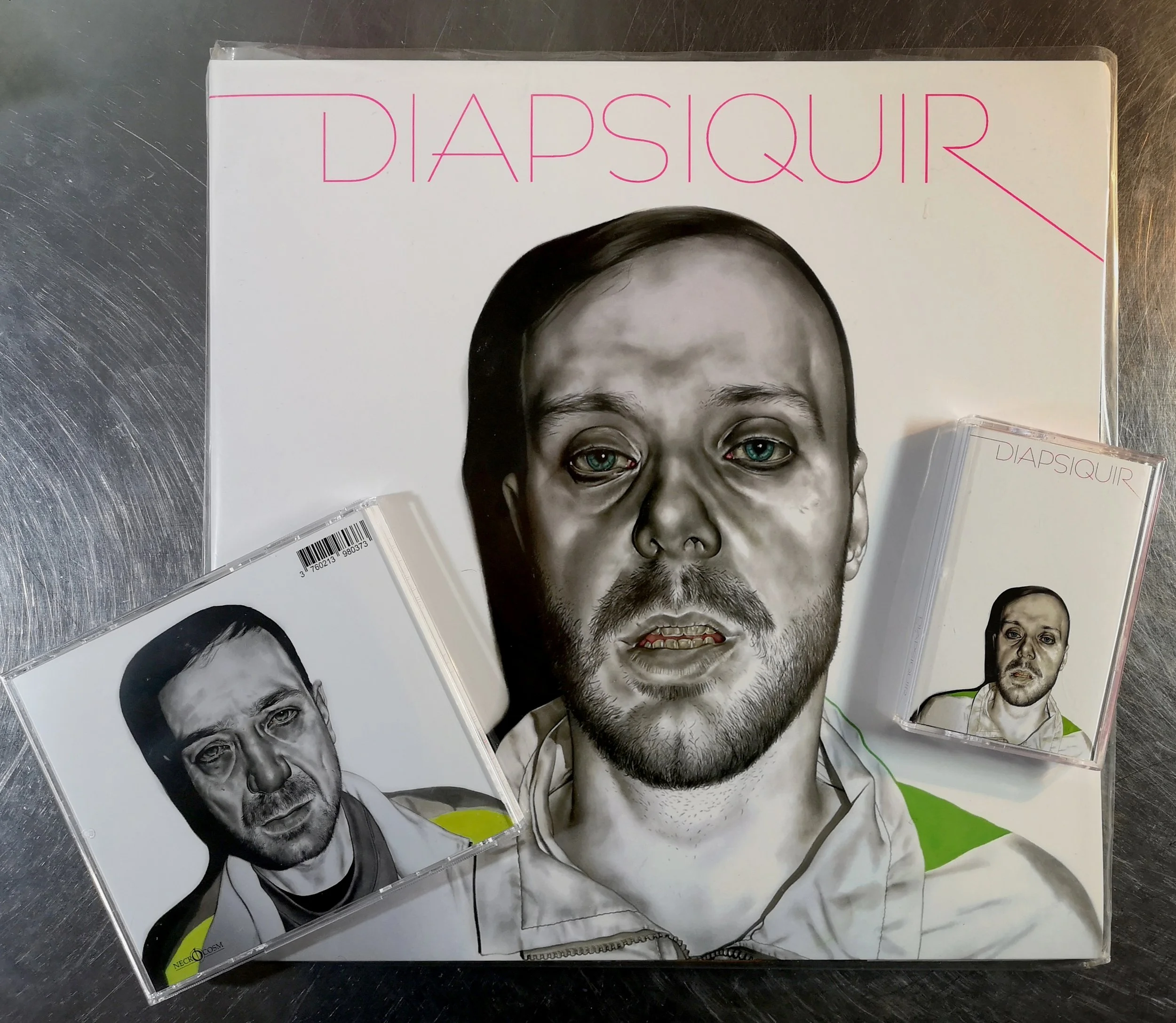 A collection of music album covers and a poster featuring a black and white portrait of a man with blue eyes, with the title 'Diapsqur' in pink letters at the top.
