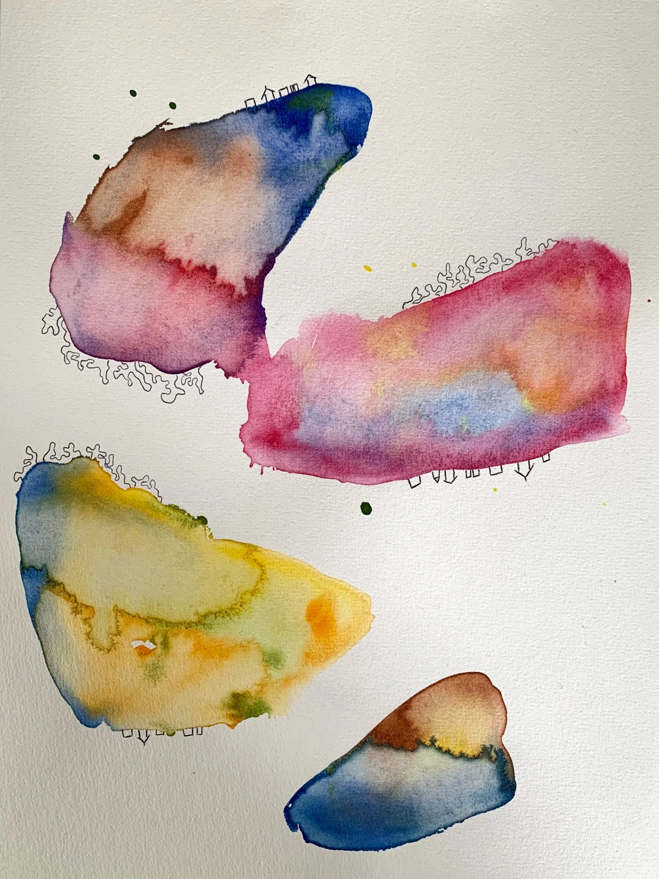 Four abstract watercolor shapes in various colors on a white background.