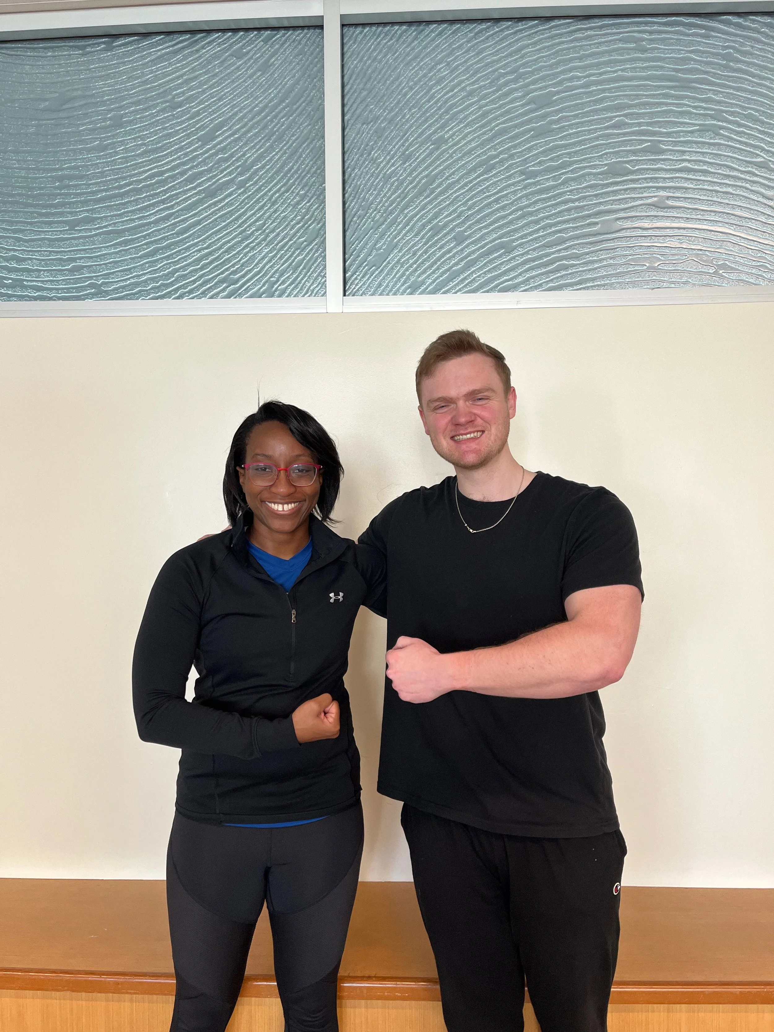 Client with personal trainer after training session.