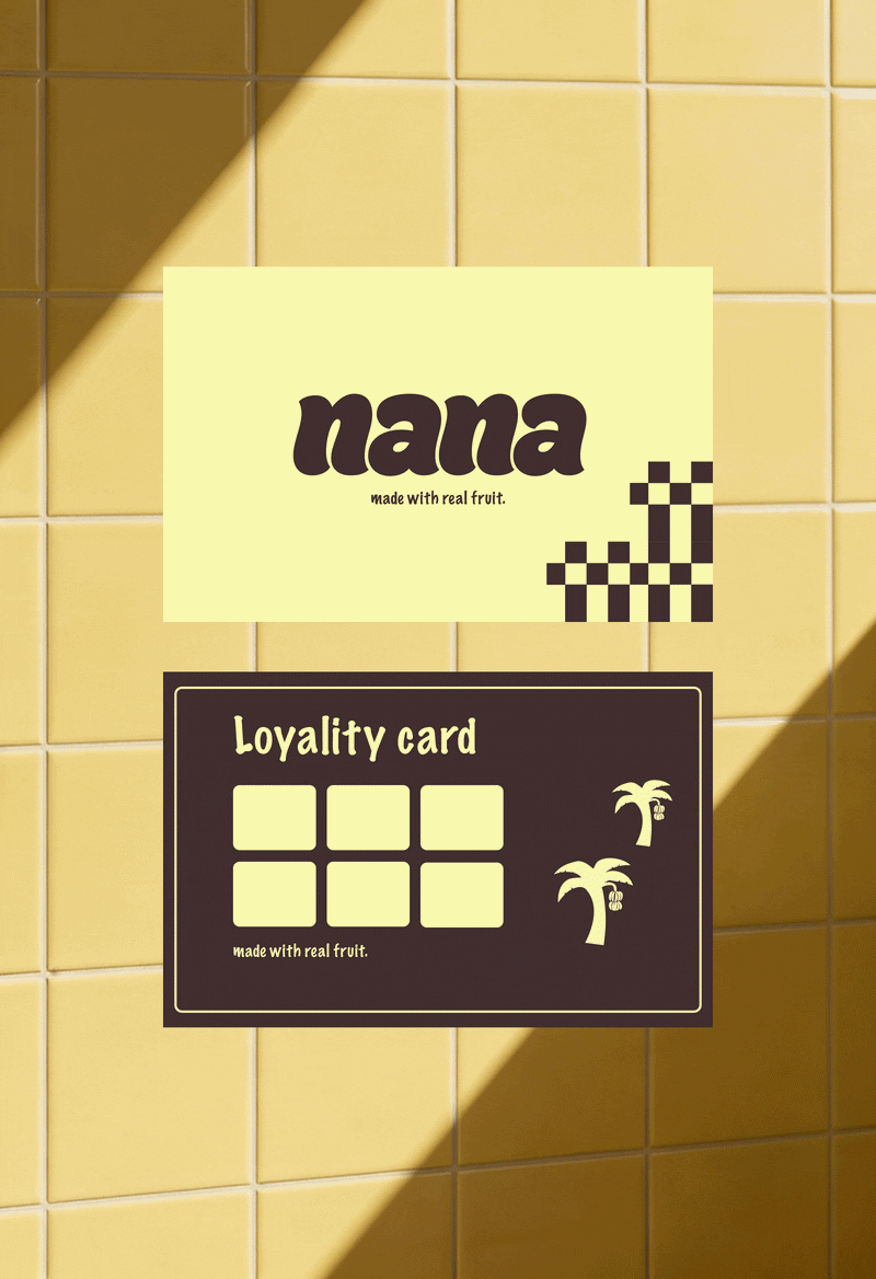 Yellow tiled wall with a Pale yellow sign reading 'nana' with the tagline 'made with real fruit' and a black section labeled 'Loyalty card' with six squares and palm tree icons.