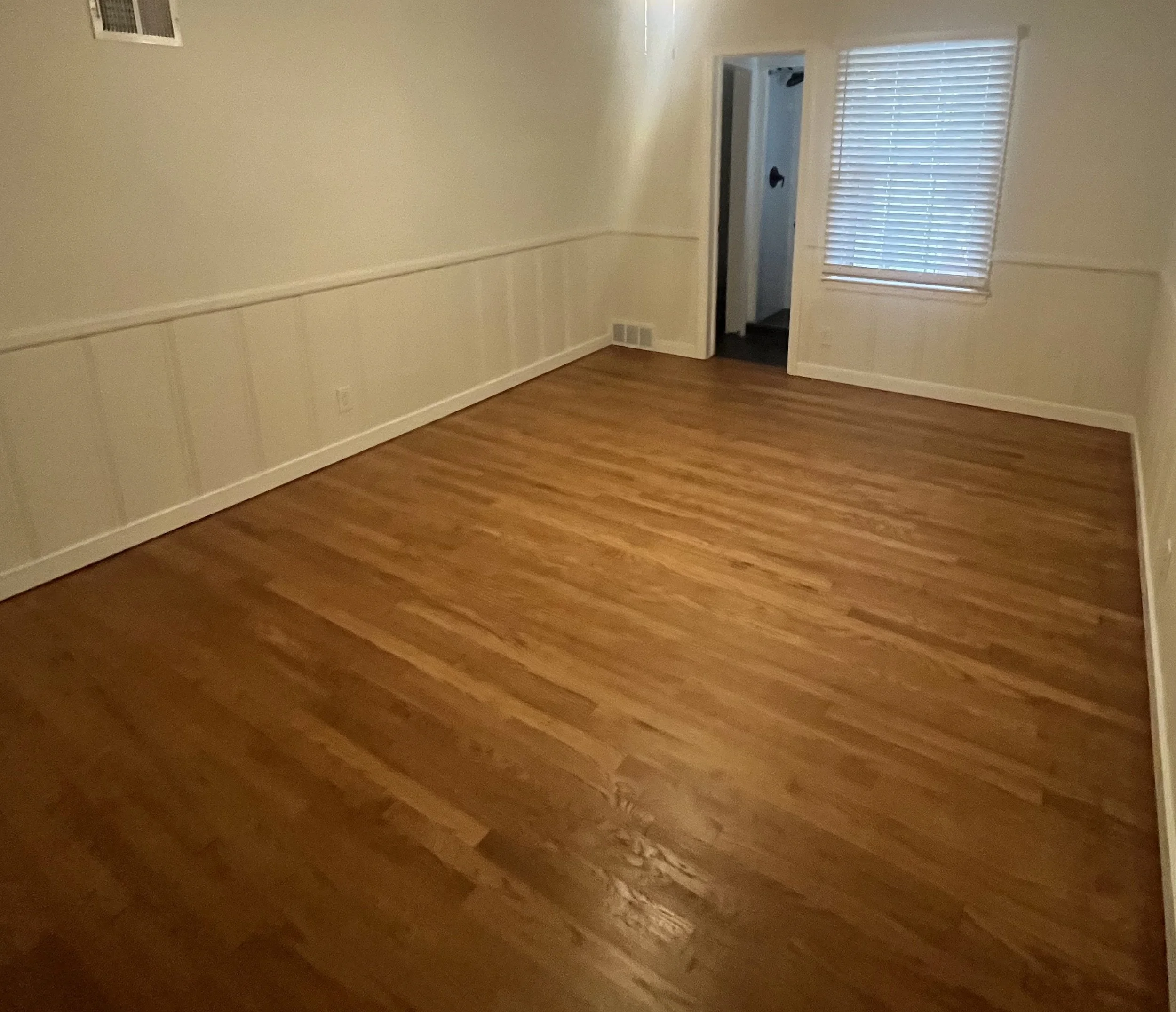 Bedroom floor, hardwood revealed & refinished (after)