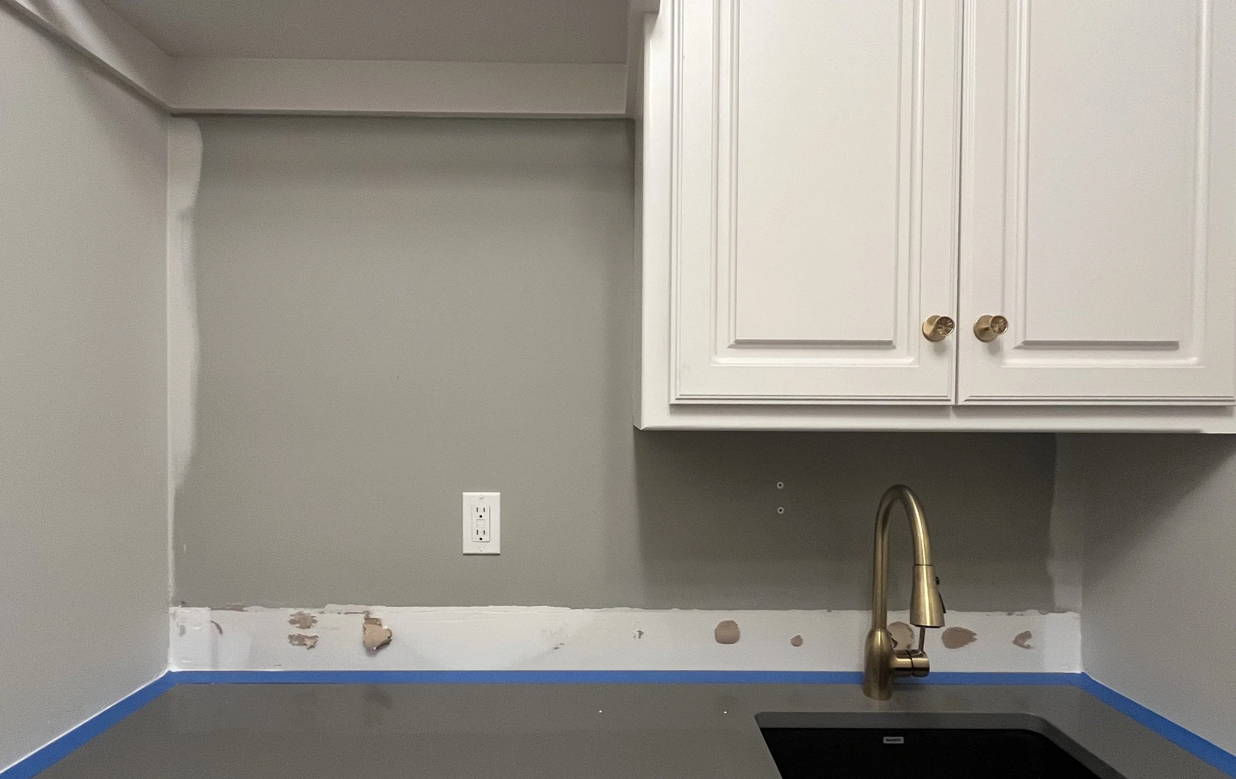 Laundry room sink, no backsplash (before)
