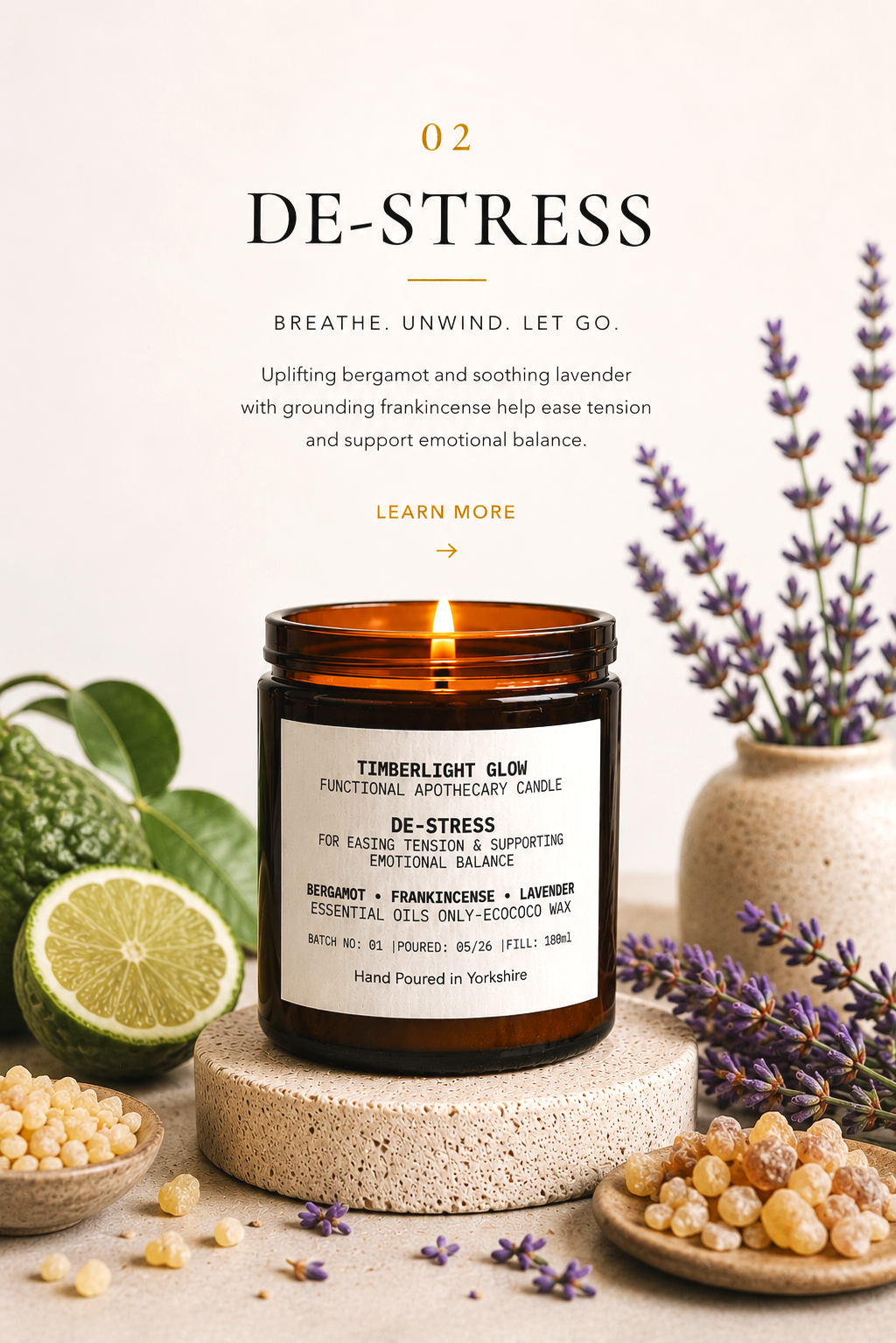 Lit TimberLight Glow De-Stress aromatherapy candle displayed with bergamot, lavender and frankincense botanicals.