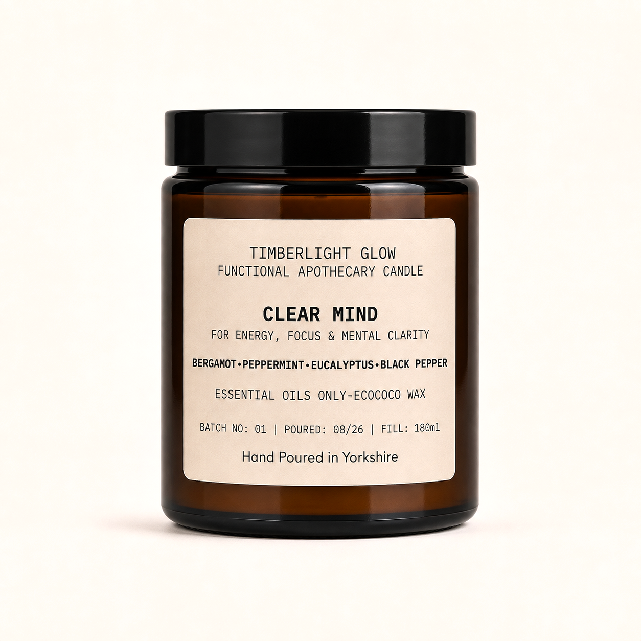 TimberLight Glow Clear Mind functional apothecary candle in an amber glass jar.