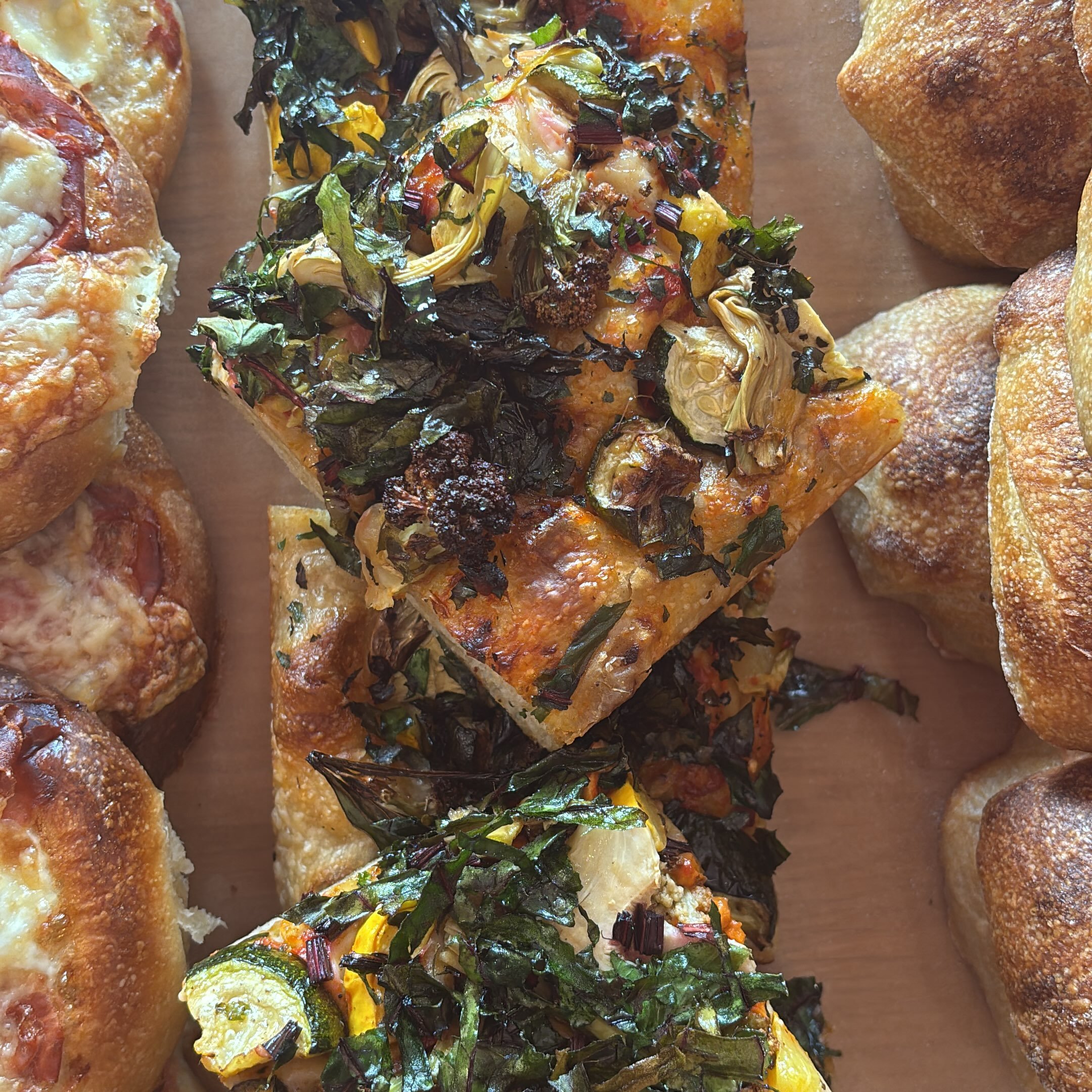 Vegan loaded focaccia! @groundedacresfarm and @thehideawaygibsons squash, brassica/ and beet tops with pepper sauce, artichokes and time #sourdough #fermentslow #bread