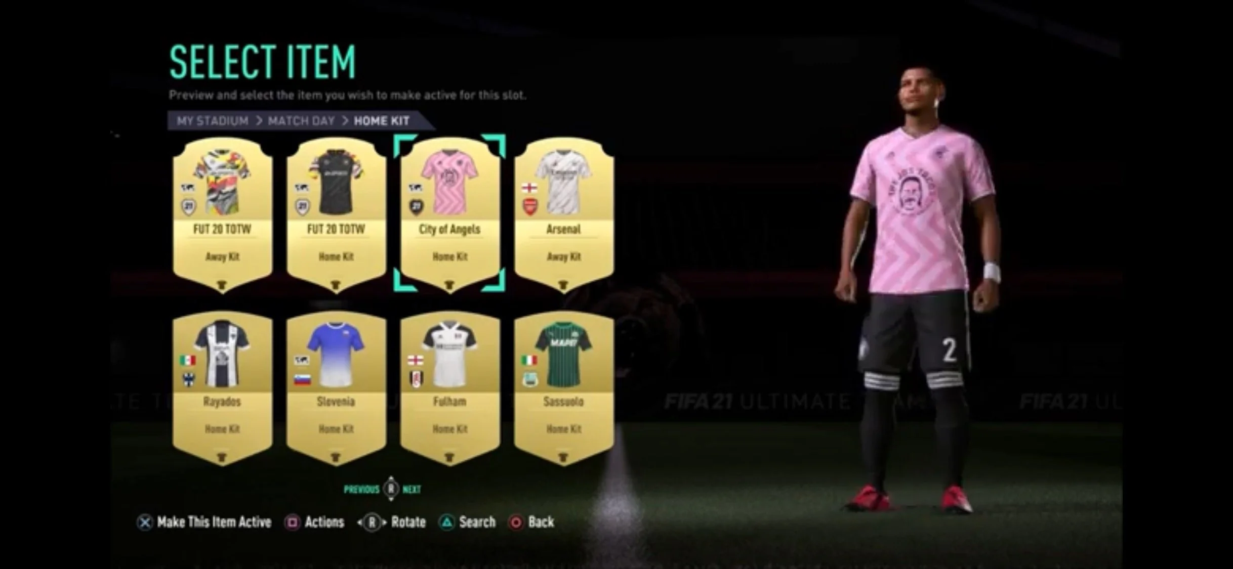In-game menu selection screen from FIFA 21 Ultimate Team showing various football kits, including Arsenal, Arsenal away, City of Angels, and others, with a player model on the right wearing a pink kit.
