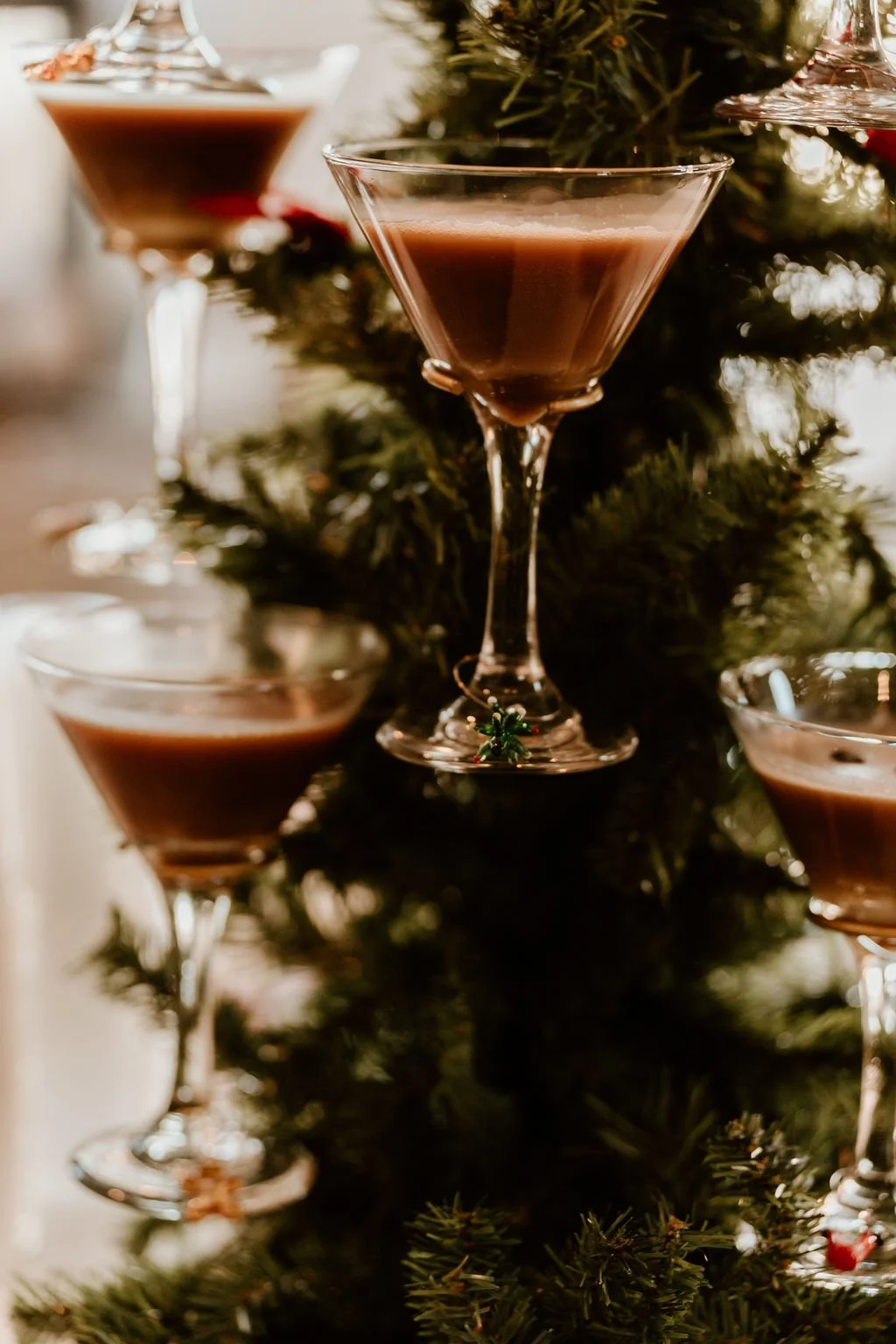 Christmas tree decorated with glasses of chocolate liqueur.