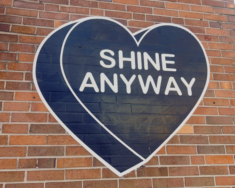 Shine Anyway heart mural on a brick wall in Philadelphia