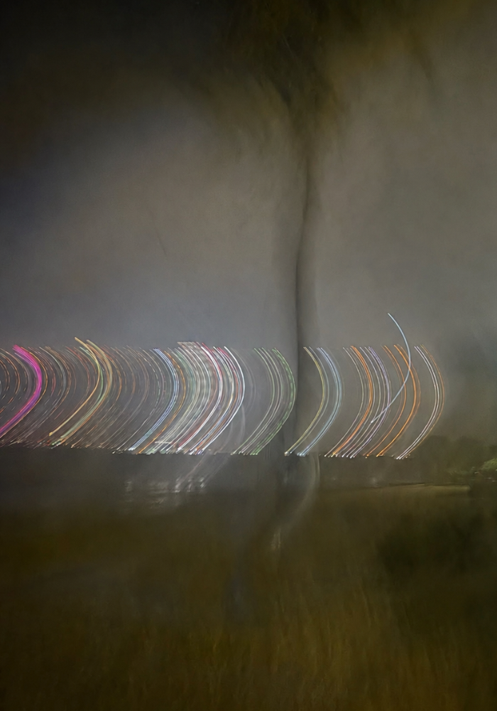 Abstract long exposure photo of colorful arcing light trails in darkness — The Relational Space Philadelphia, therapy for emotionally complex and neurodivergent adults
