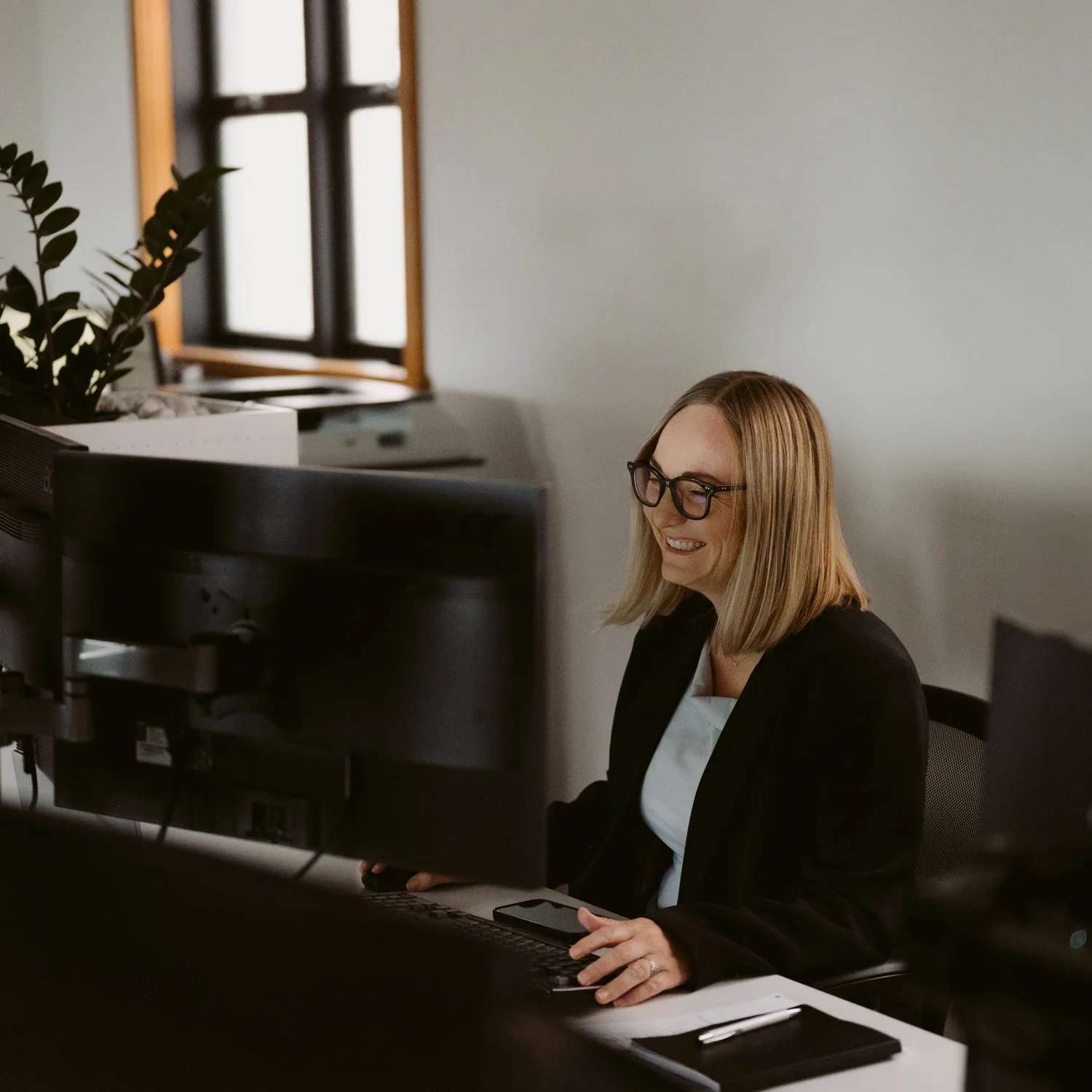 A self-employed business owner reviewing accounts.