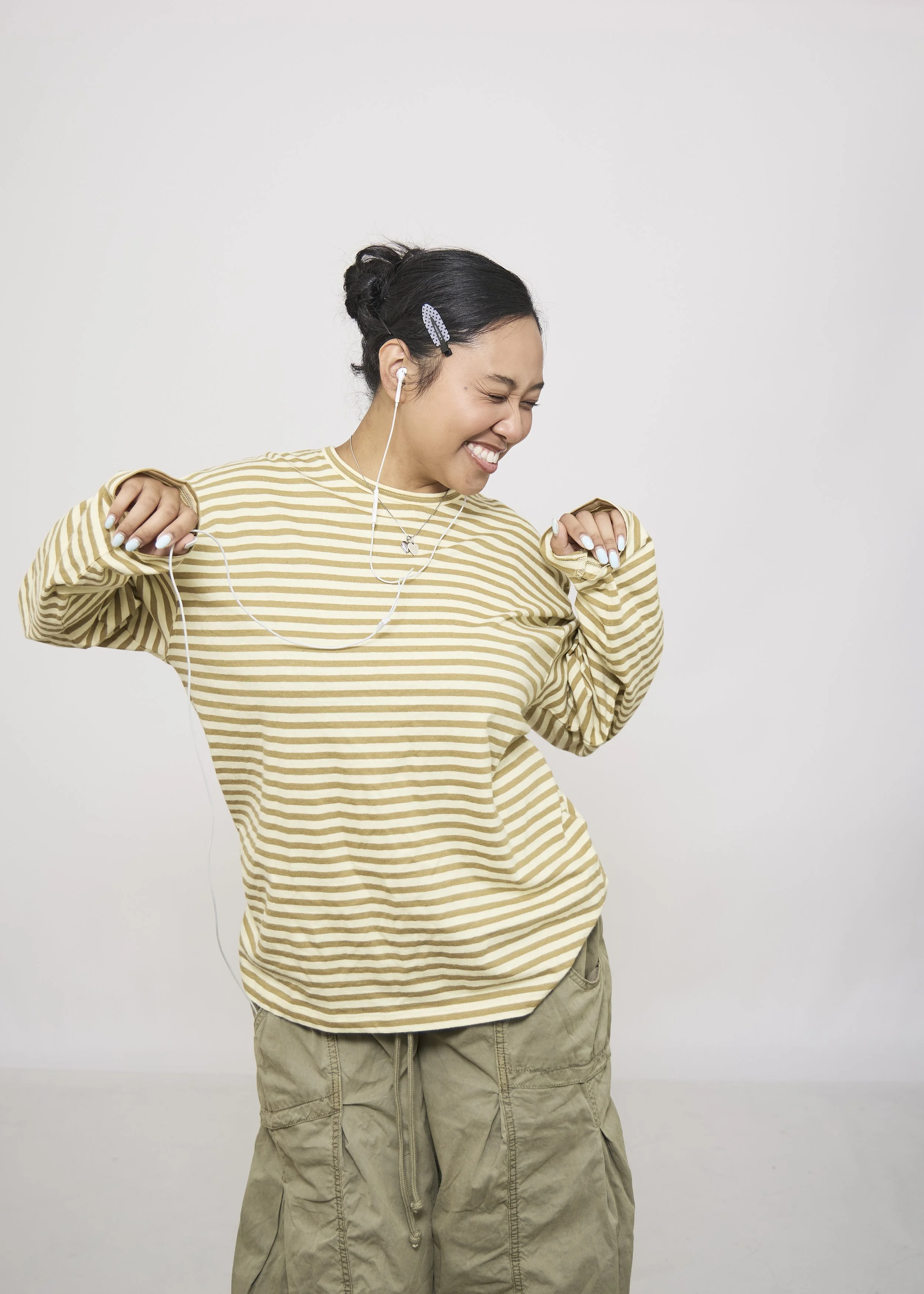 girl having fun taking photos with white backdrop