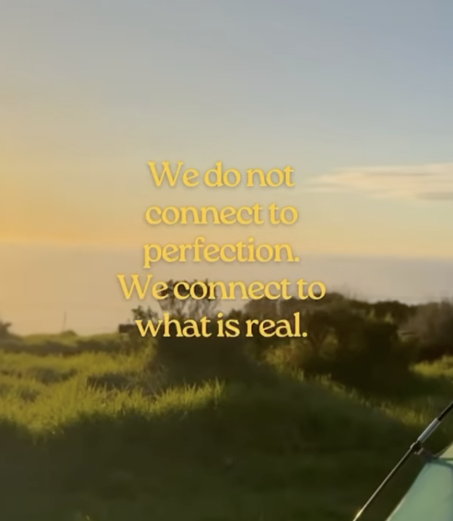 Sunset over a grassy landscape with the quote, 'We do not connect to perfection. We connect to what is real,' written in yellow text.