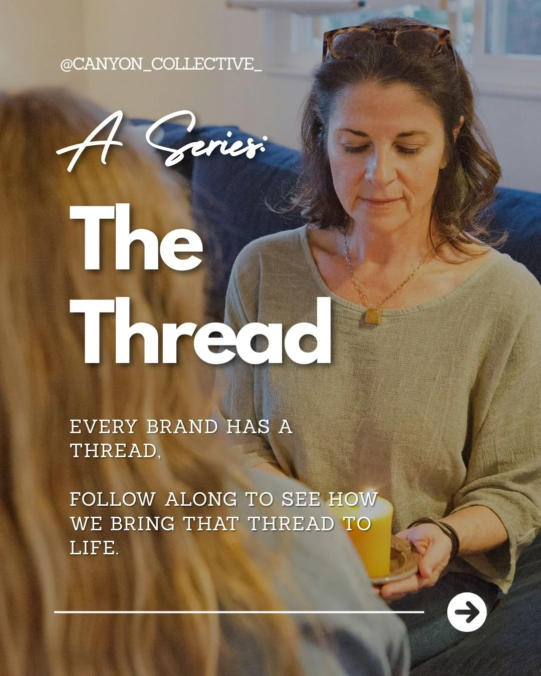 Two women sitting on a couch, one with brown hair and glasses on her head, holding a small plate with a lit candle, indoor setting with window in the background, promotional content for a series called 'The Thread' by @CANYON_COLLECTIVE_.