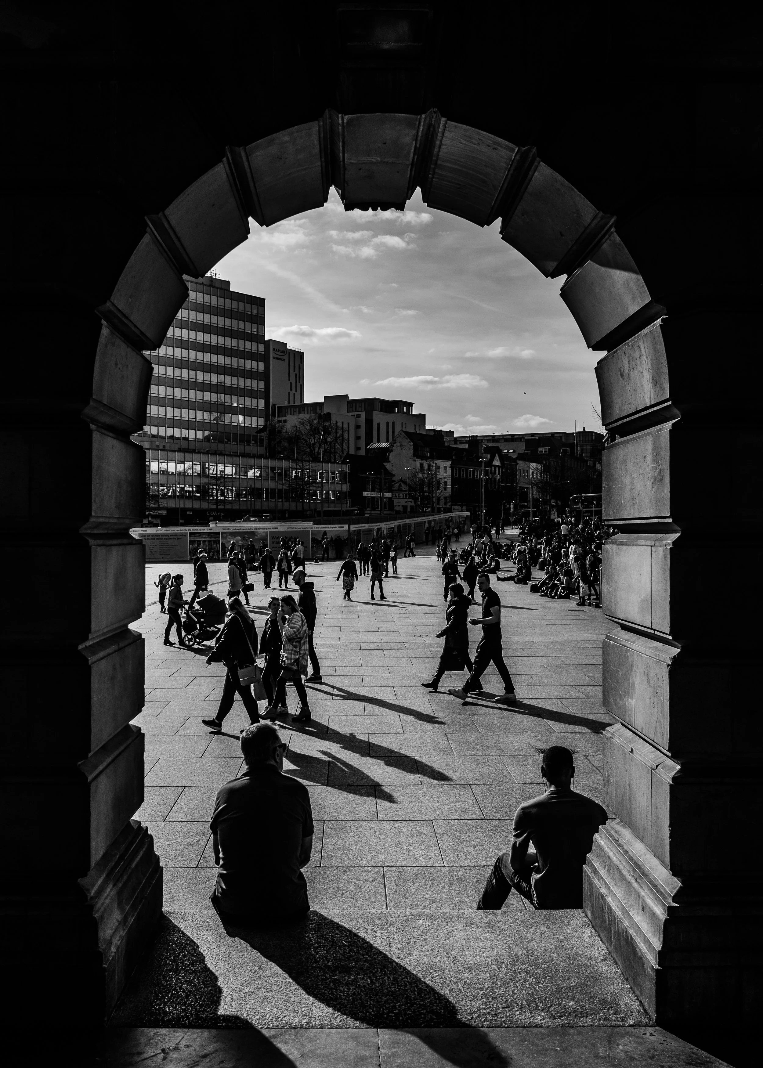Looking out upon Old Market Square, Nottingham, from under the arches near the 'Right Lion", 25th March 2016. Fujifilm X-Pro2, XF18mm, 1/2400, f4, ISO 200.