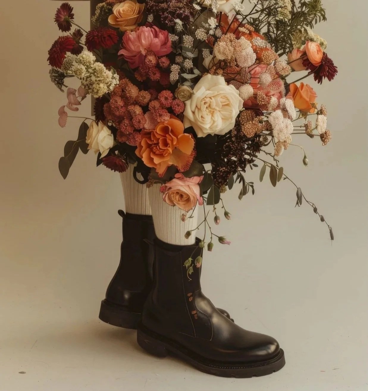 Shoes blooming with flowers symbolizing bold intentional steps and transformative personal development coaching.