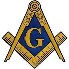 Freemason symbol with a square and compass surrounding a blue square and compass symbol with a gold G in the center.