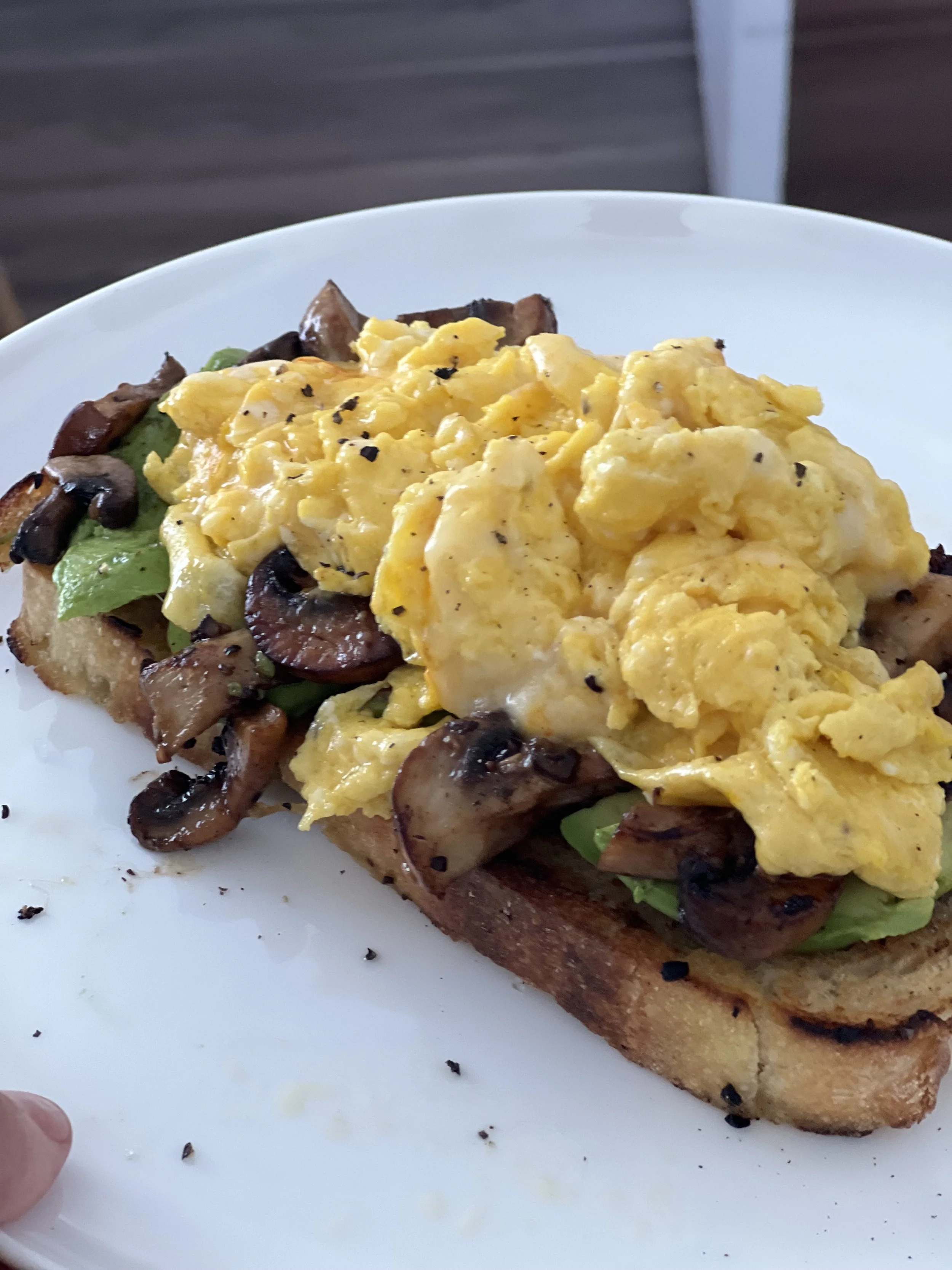 Mushrooms's avocado toast with soft scrambled eggs