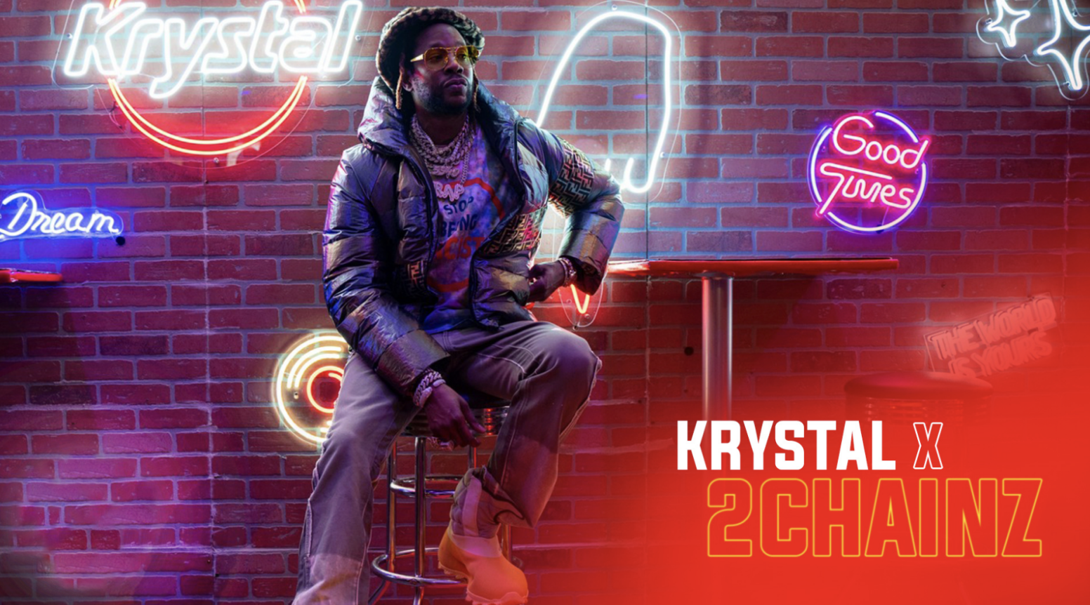 A man with sunglasses, jewelry, and a puffy jacket sitting on a bar stool in front of a brick wall illuminated with colorful neon signs. The signs include words like "Krystal," "Dream," "Good Tunes," and designs like a smiley face and stars. There is