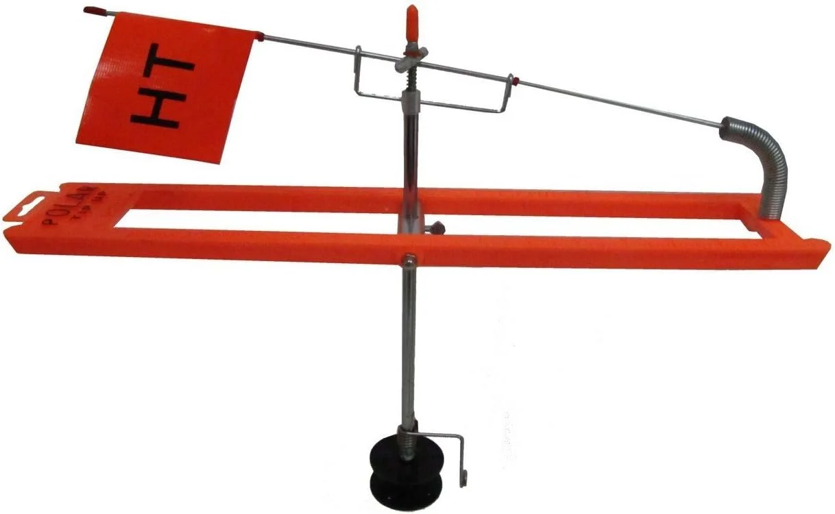 A red and metal rotating wind indicator with a pole, a blade, and a base, used for wind direction measurement.