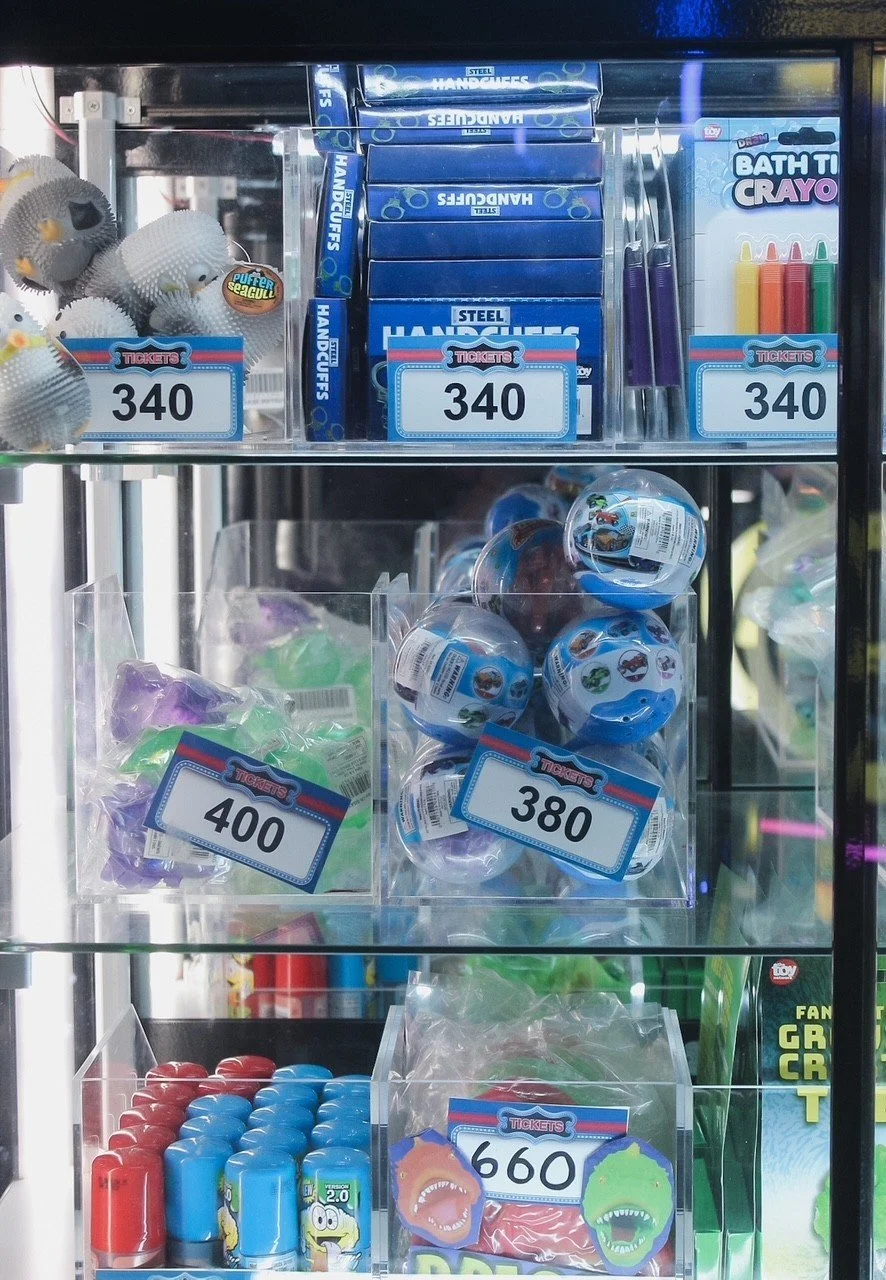 Prize counter shelves with ticket prices in the arcade at Silver Stone Castle, Swansea, MA