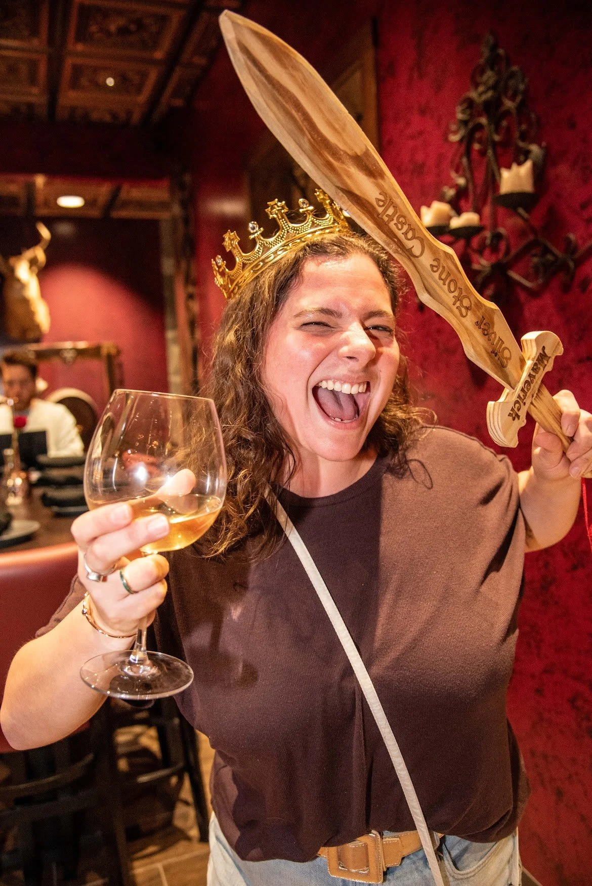 A crown, a sword and a glass of wine