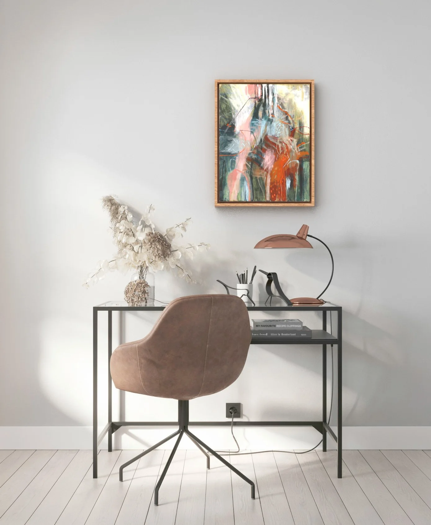 A modern desk setup with a brown upholstered swivel chair, a black metal desk, a desk lamp, decorative black bird sculptures, a vase with dried flowers, and books on the lower shelf. A colorful abstract painting hangs on the white wall above.