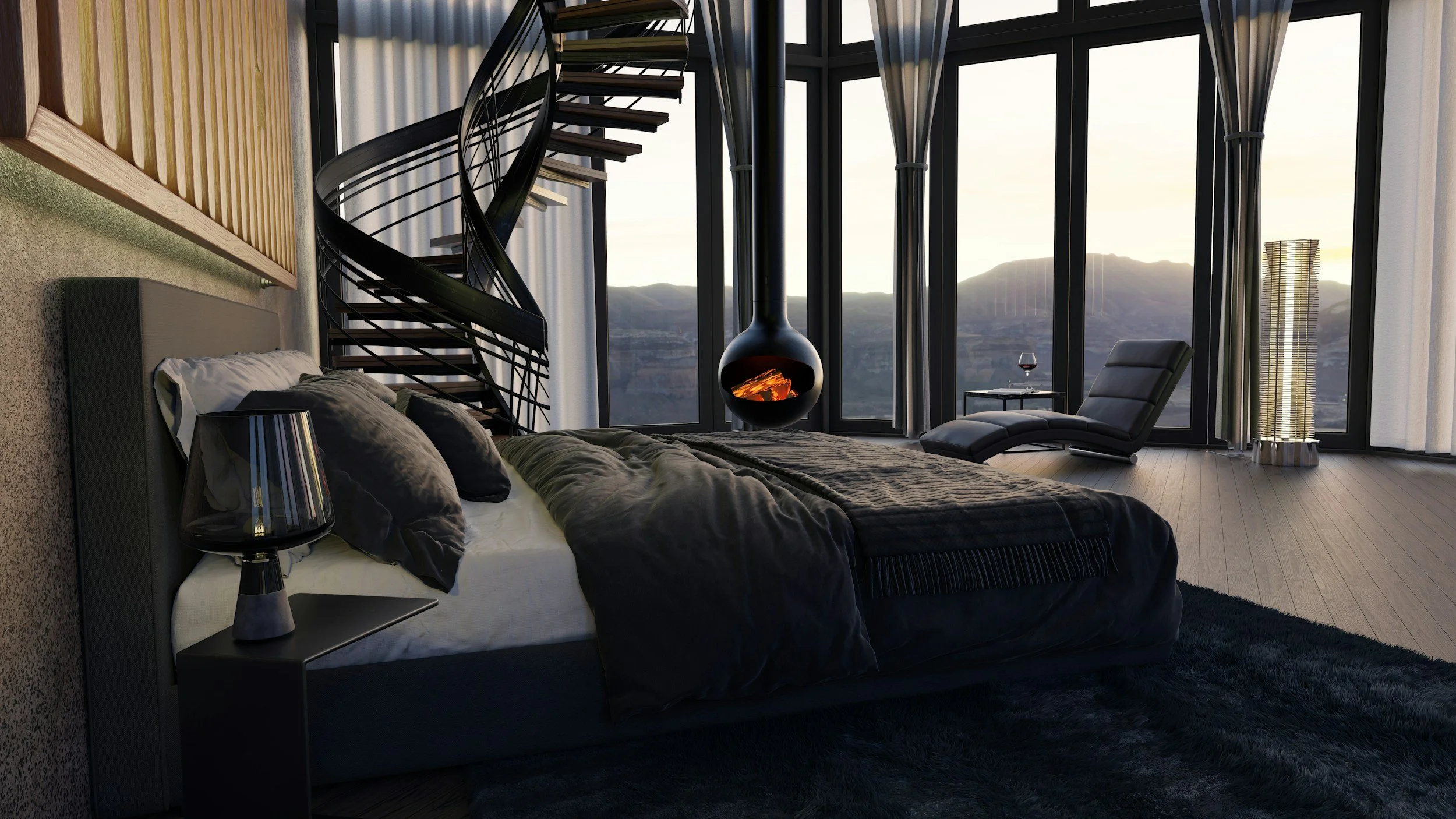 Modern bedroom with large floor-to-ceiling windows, a black spiral staircase, a suspended fireplace, a black lounge chair, a floor lamp, a glass of wine on a side table, and a view of mountains outside.