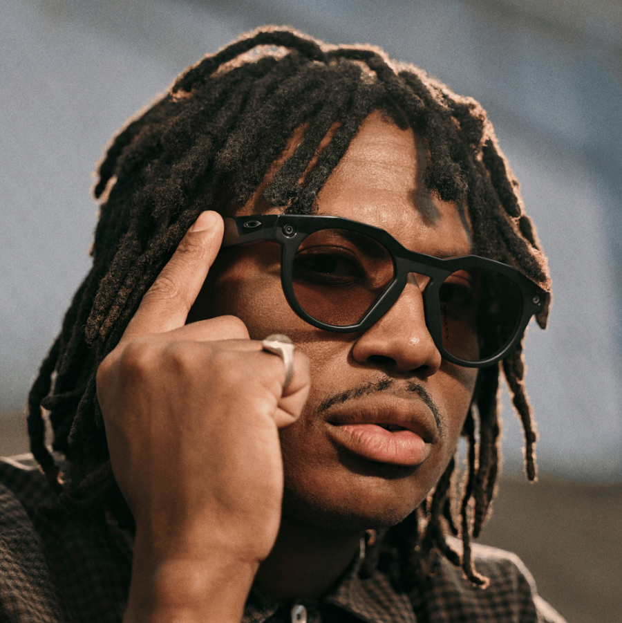 Model wearing black Oakley Meta Smart Glasses
