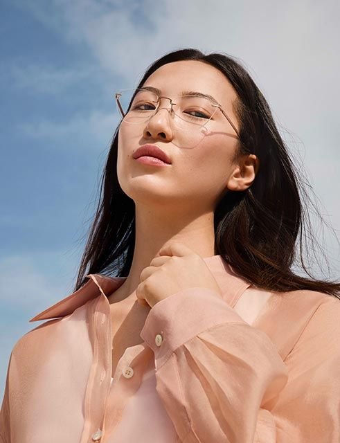 Model wearing Silhouette The Visionary 5586 eyeglasses with cat-eye lenses