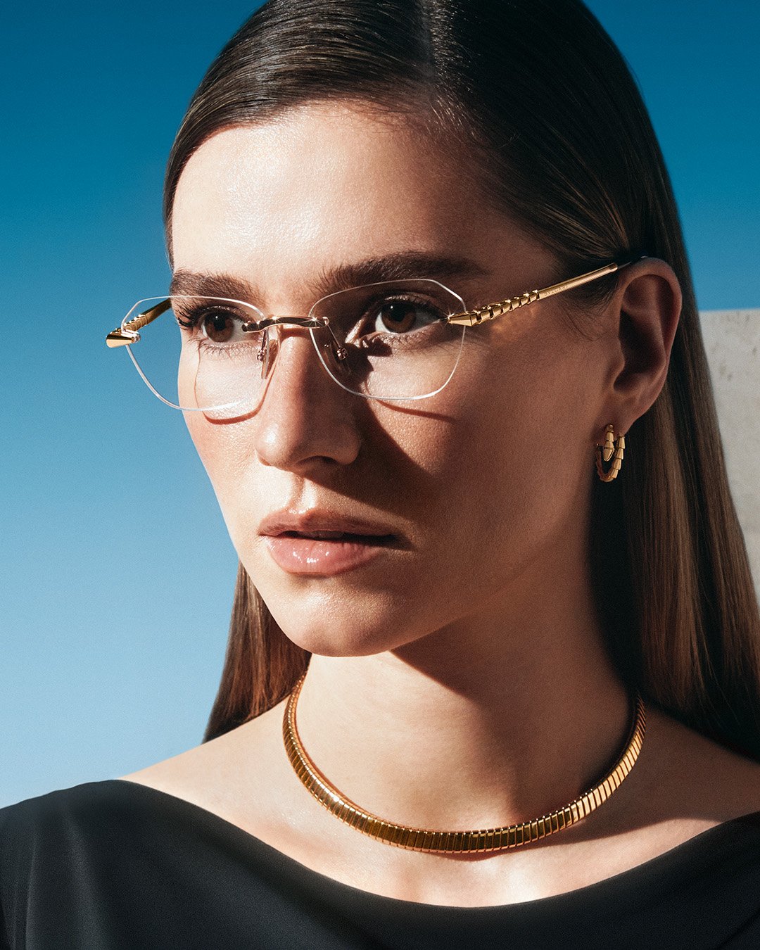Model wearing Blvgari rimless glasses
