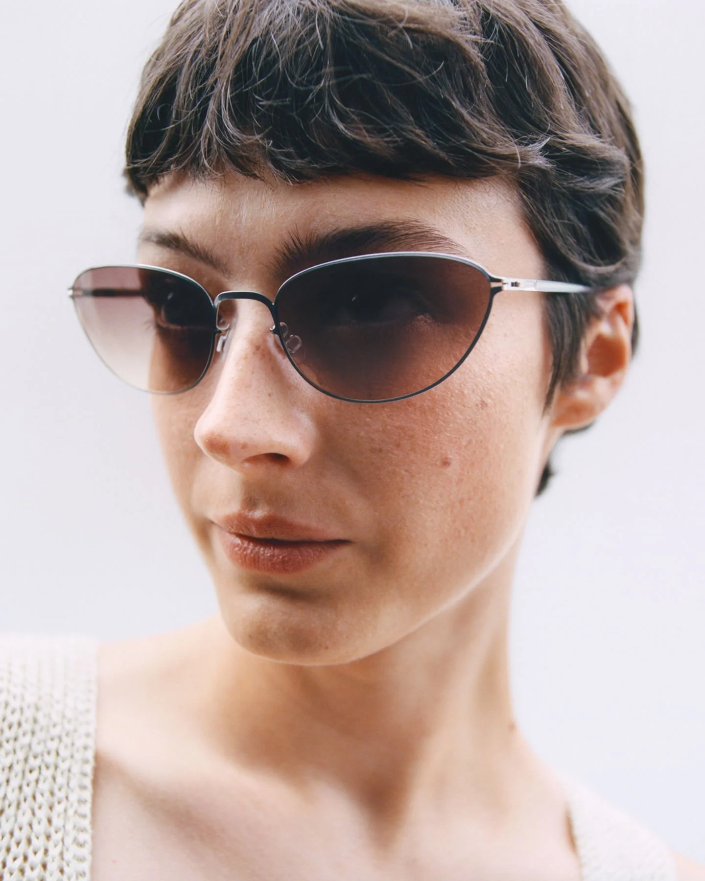 Model wearing Mykita sunglasses